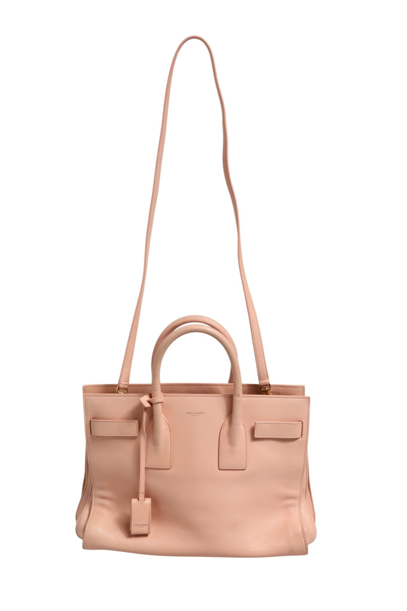 Discover the Saint Laurent Nano Sac De Jour, a pink masterpiece of exquisite craftsmanship that embodies luxury and sophistication for the discerning individual.