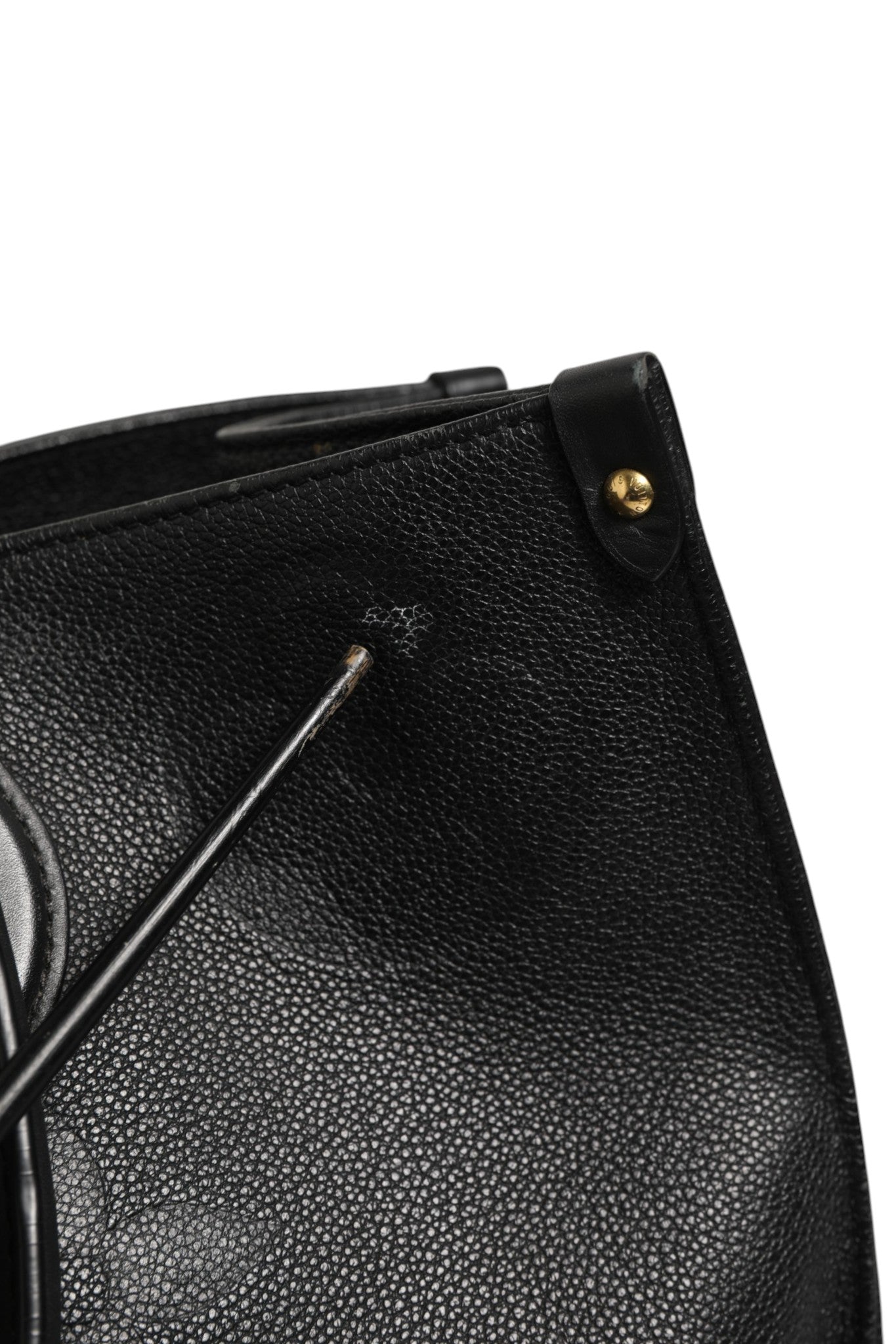 Discover the Louis Vuitton OnTheGo GM Monogram Empreinte Leather handbag, a symbol of refined elegance and timeless luxury, perfect for those who command sophistication.