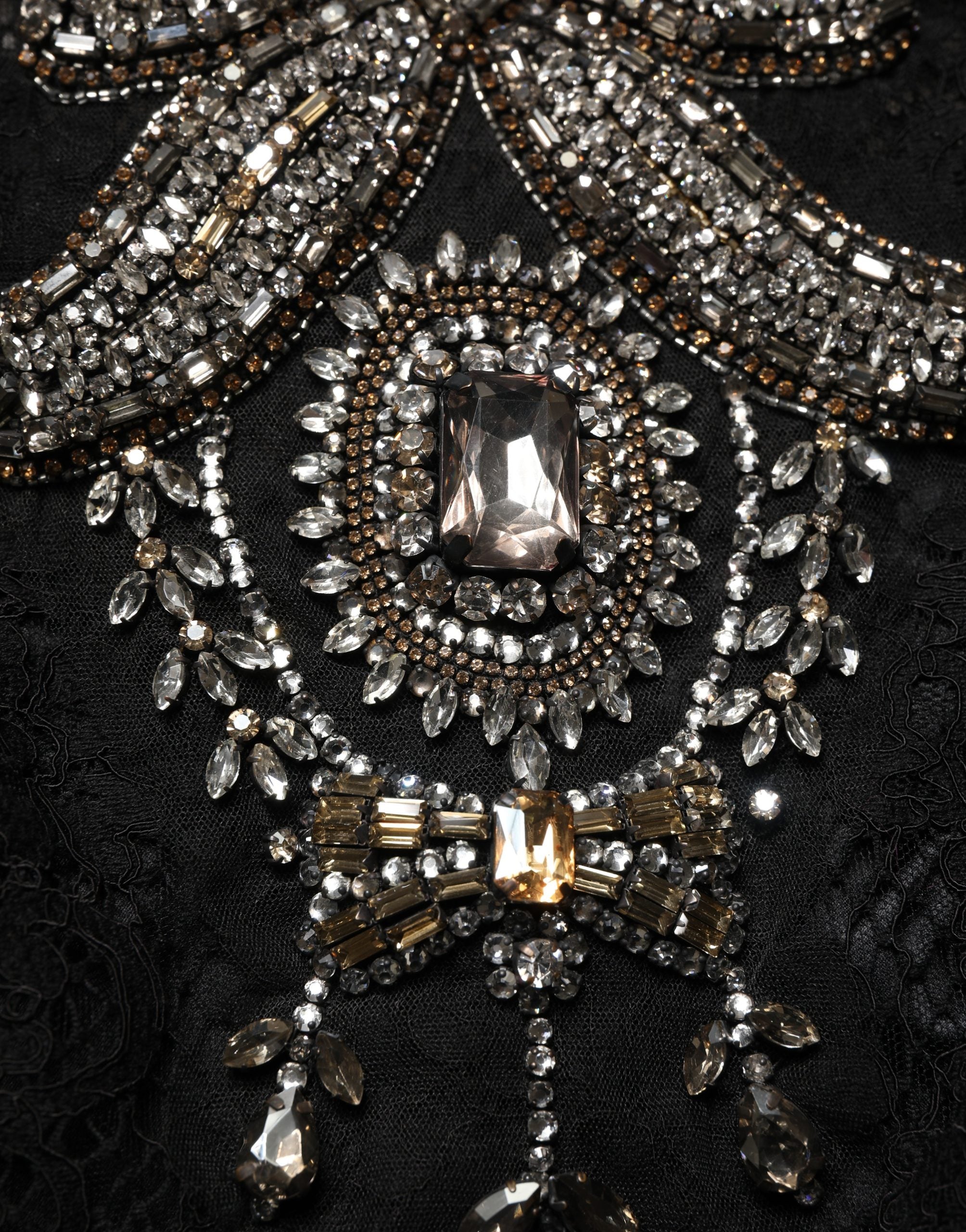 Elevate your wardrobe with the Dolce & Gabbana Black Crystal Embellished Sheath Midi Dress, a masterpiece of Italian craftsmanship that embodies timeless elegance and allure.