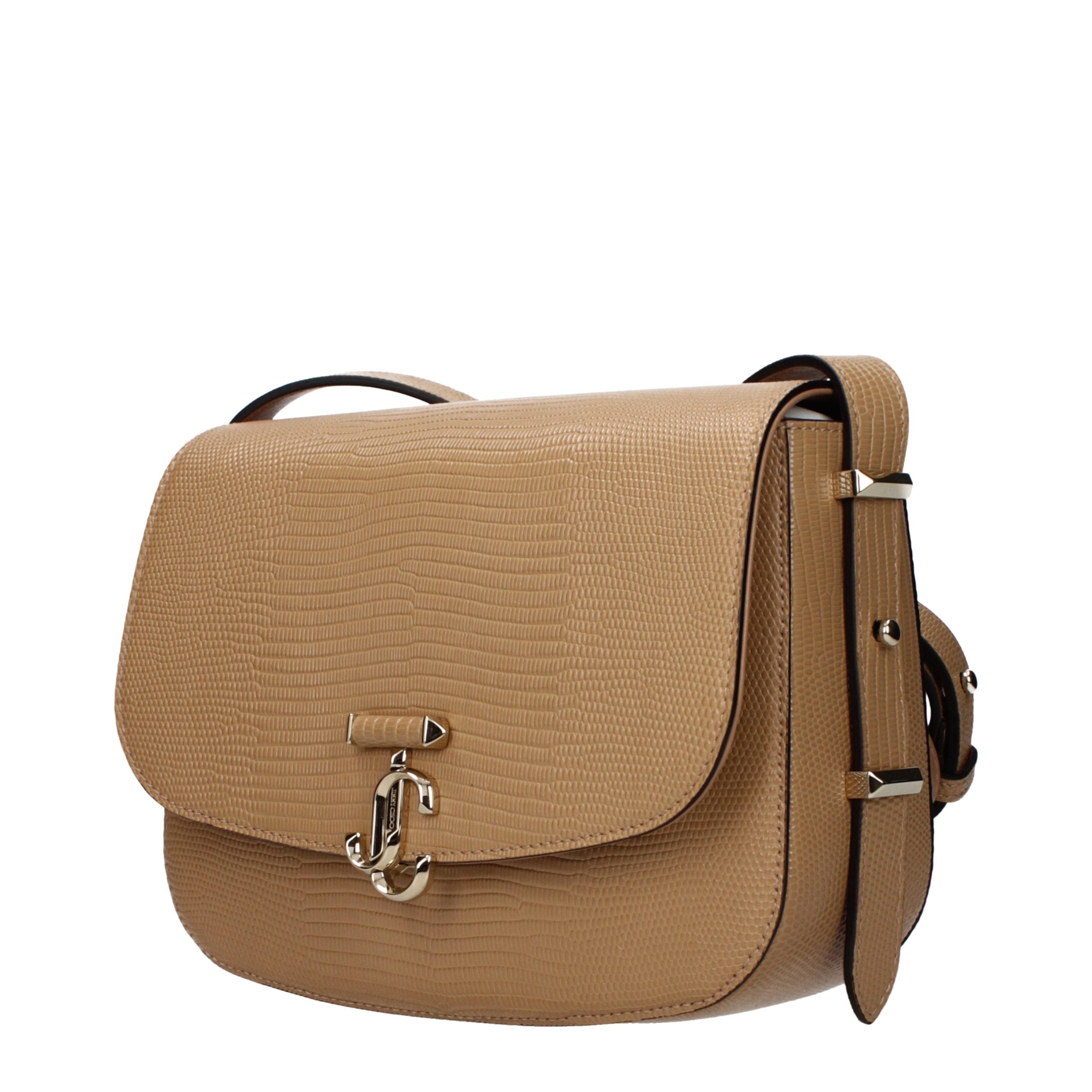 Indulge in the exquisite elegance of the Jimmy Choo Brown Leather Crossbody Bag, a testament to artisan craftsmanship and timeless luxury, perfect for the discerning individual.
