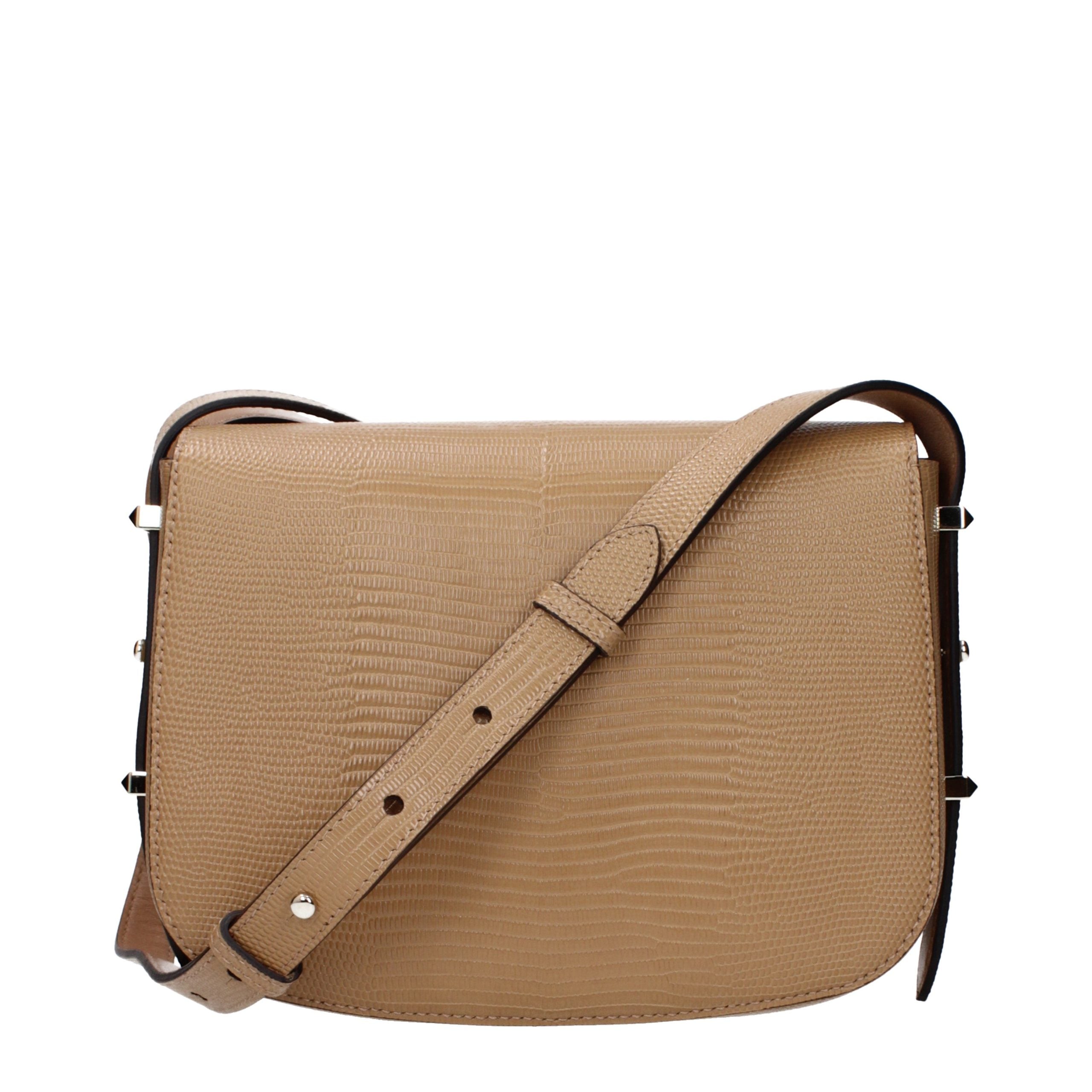 Discover the Jimmy Choo Brown Leather Crossbody Bag, a masterpiece of artisan craftsmanship that elevates your style with timeless elegance and luxurious allure.