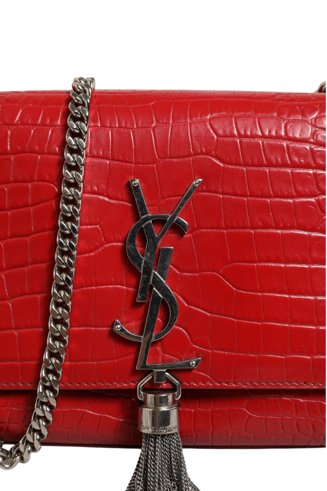 Indulge in the allure of the Saint Laurent Kate Tassel Chain Bag, a masterpiece of red crocodile embossed leather, embodying timeless elegance and sophisticated charm.