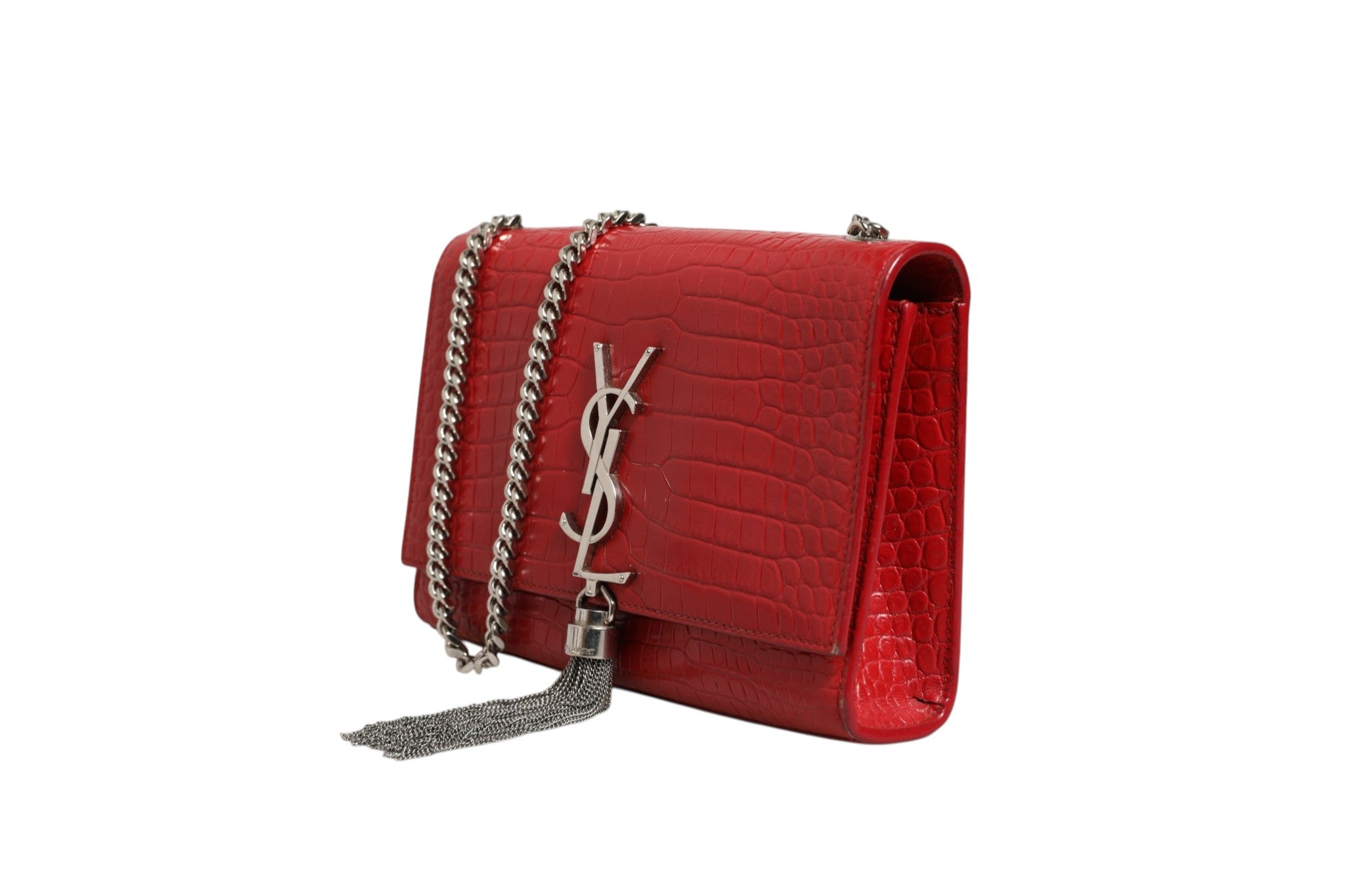 Indulge in the allure of the Saint Laurent Kate Tassel Chain Bag, crafted from exquisite red crocodile embossed leather, a timeless statement of luxury and sophistication.