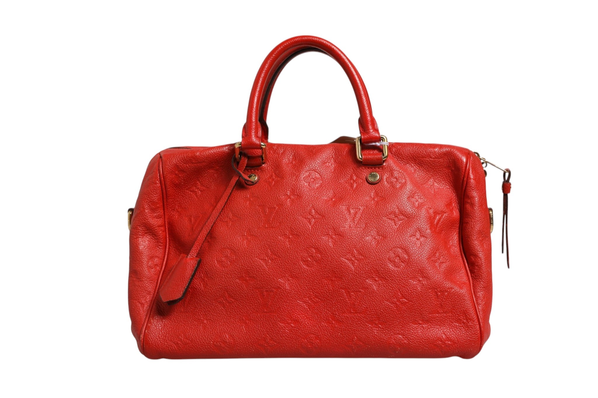 Elevate your style with the Louis Vuitton Red Monogram Empreinte Speedy Bandouliere 30, a timeless luxury handbag that embodies exquisite craftsmanship and sophistication.