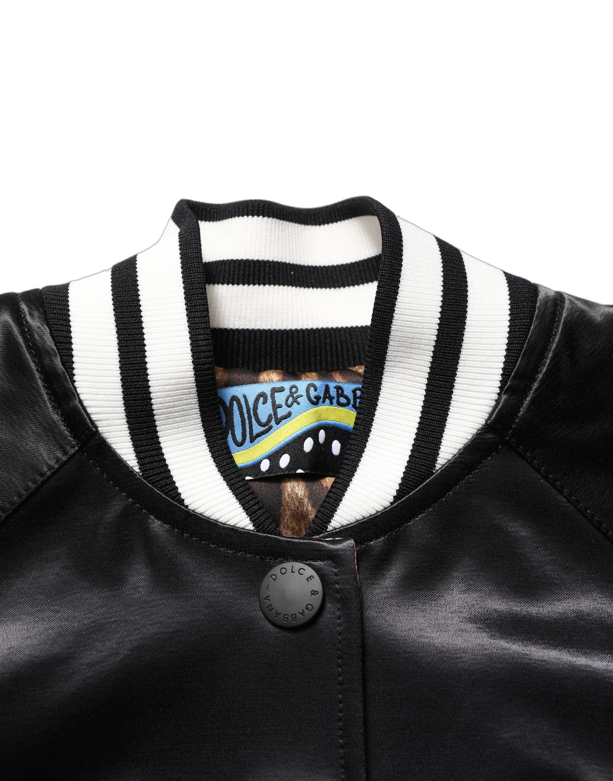 Discover the Dolce & Gabbana Black Satin Floral Embroidery Bomber Jacket, a masterpiece of Italian craftsmanship blending elegance and artistry for the discerning individual.