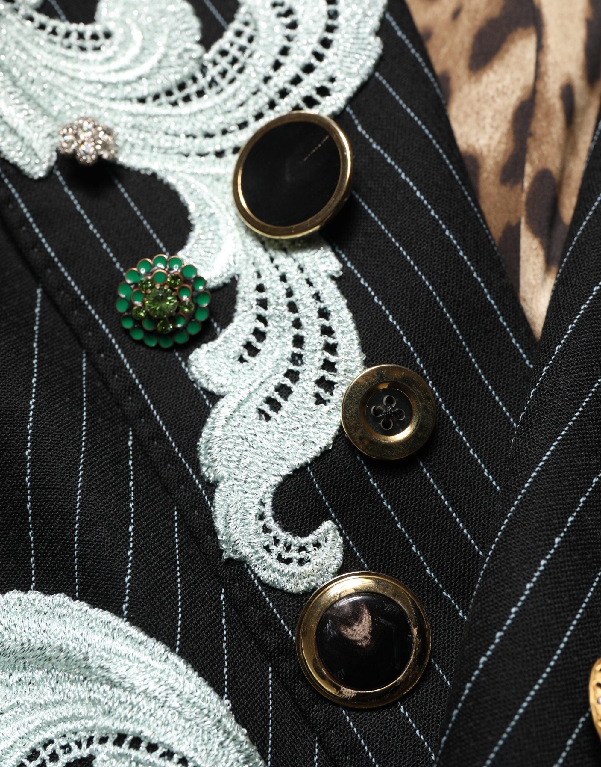 Elevate your style with the Dolce & Gabbana Black Stripe Double-Breasted Blazer, a luxurious blend of virgin wool and exquisite embroidery, embodying timeless sophistication.