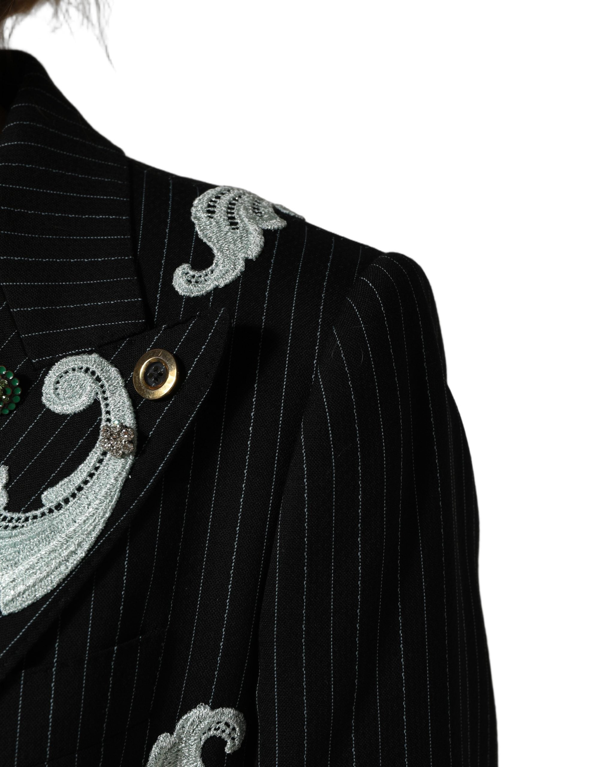 Elevate your wardrobe with the Dolce & Gabbana Black Stripe Double-Breasted Blazer, a masterpiece of luxurious virgin wool and exquisite embroidery, embodying timeless elegance.