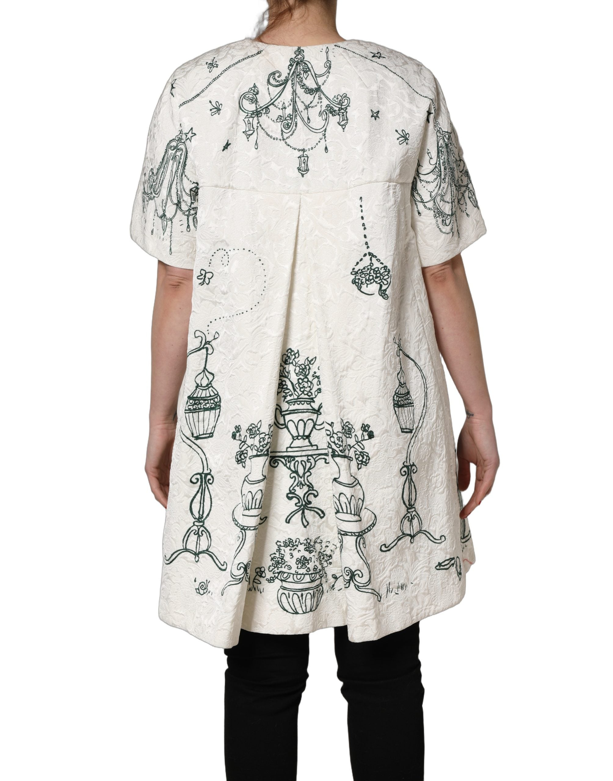 Indulge in the exquisite Dolce & Gabbana White Jacquard Garden Print Coat, a masterpiece of Italian craftsmanship, blending luxurious silk and cotton for timeless elegance.