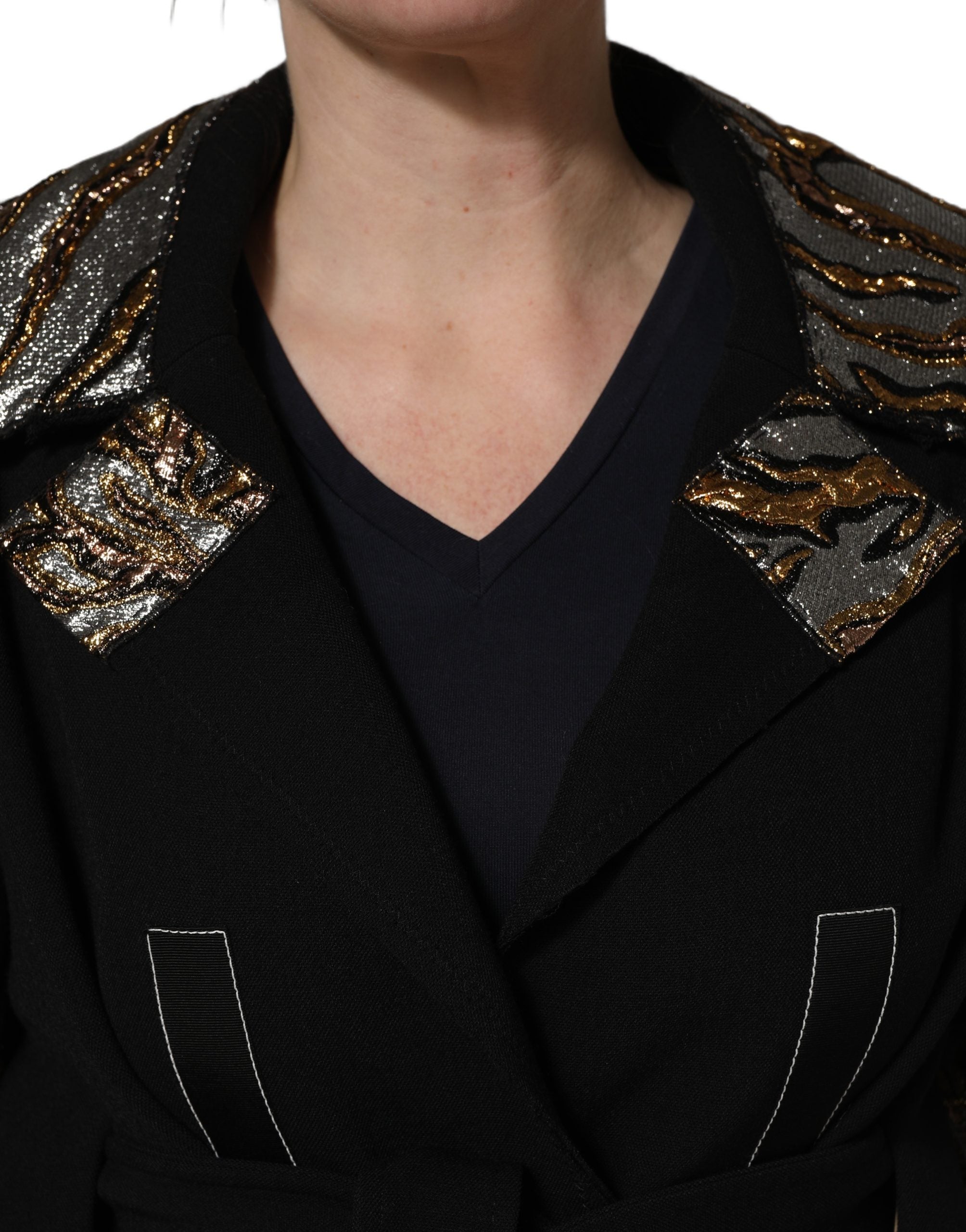 Experience the exquisite Dolce & Gabbana Black Single-Breasted Brocade Coat, where luxurious materials and timeless design elevate your wardrobe to new heights of sophistication.