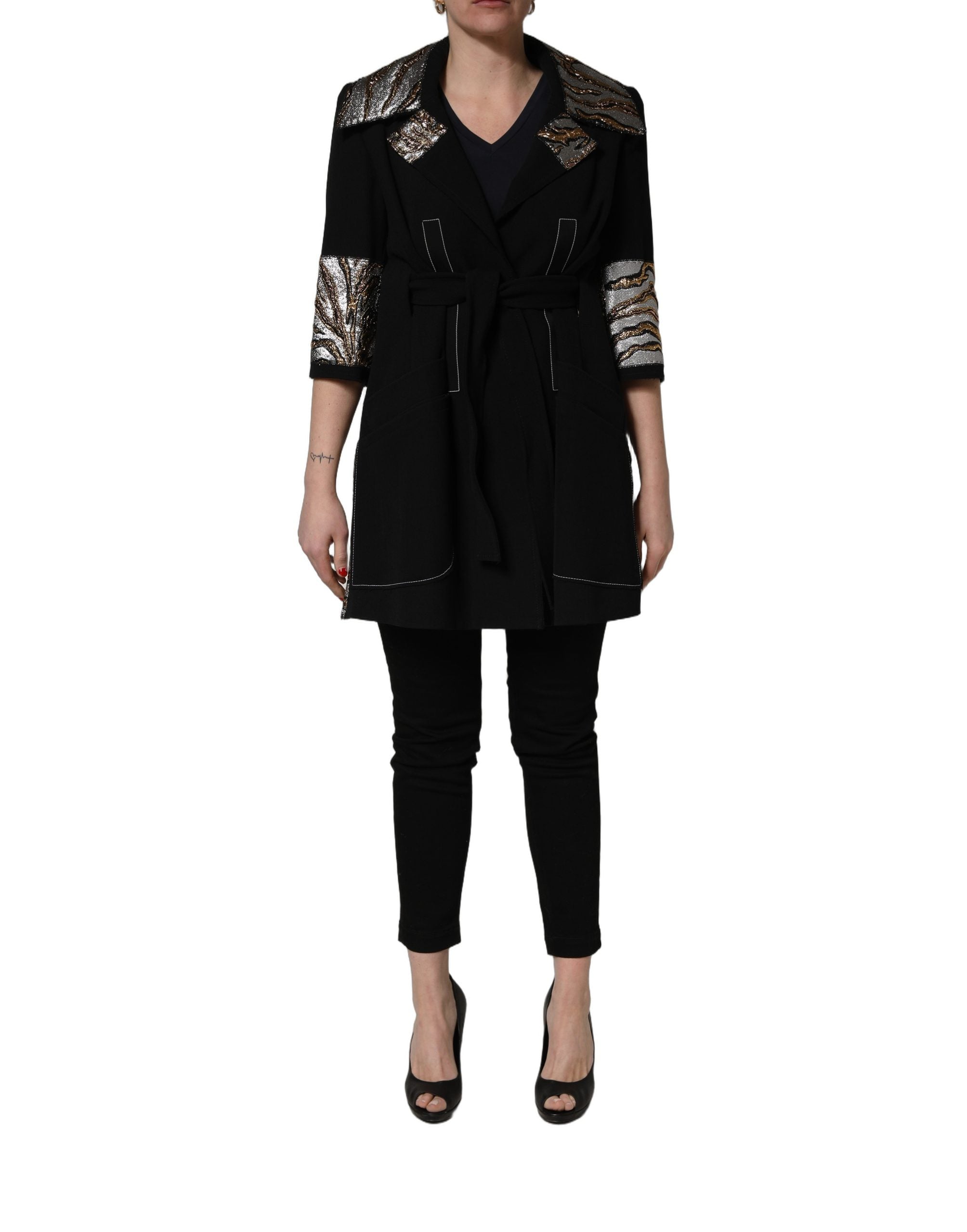 Experience the allure of the Dolce & Gabbana Black Single-Breasted Brocade Coat, a masterpiece of luxurious craftsmanship, perfect for those who embody elegance and sophistication.