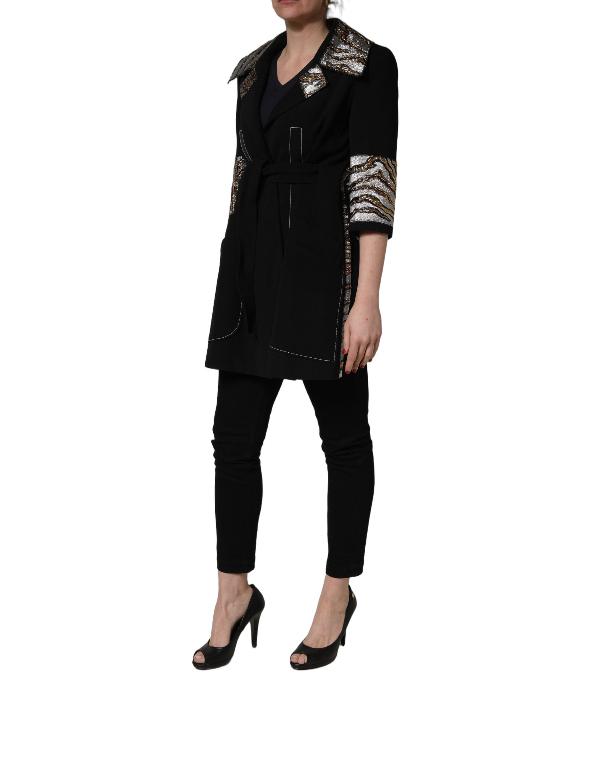 Discover the Dolce & Gabbana Black Single-Breasted Brocade Coat, a timeless masterpiece of luxurious materials and exquisite craftsmanship, perfect for any refined wardrobe.