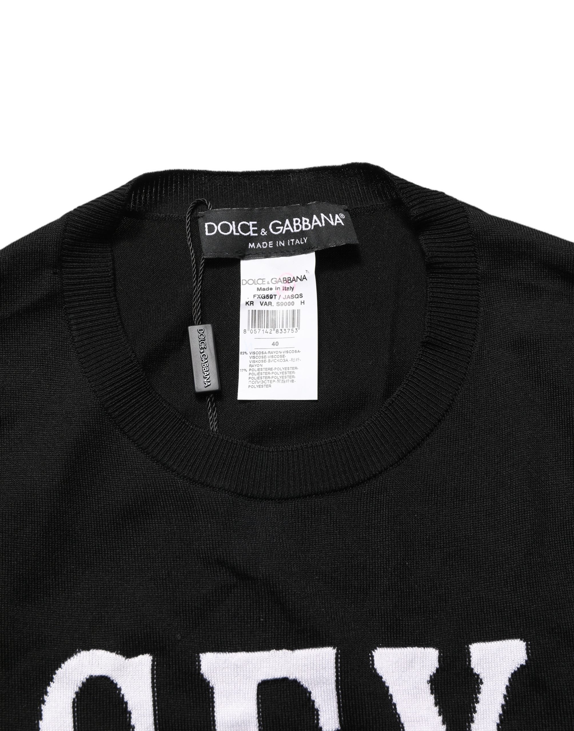 Indulge in the exquisite Dolce & Gabbana Black Graphic Print Long-Sleeved Top, a luxurious blend of artistry and comfort, perfect for the discerning fashion connoisseur.