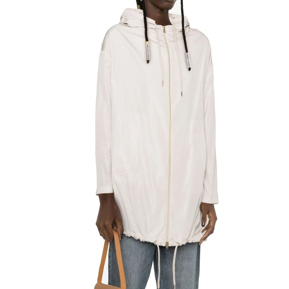 Discover the Herno White Polyester Coat, a masterpiece of Italian craftsmanship, blending elegance and functionality for a sophisticated lifestyle.