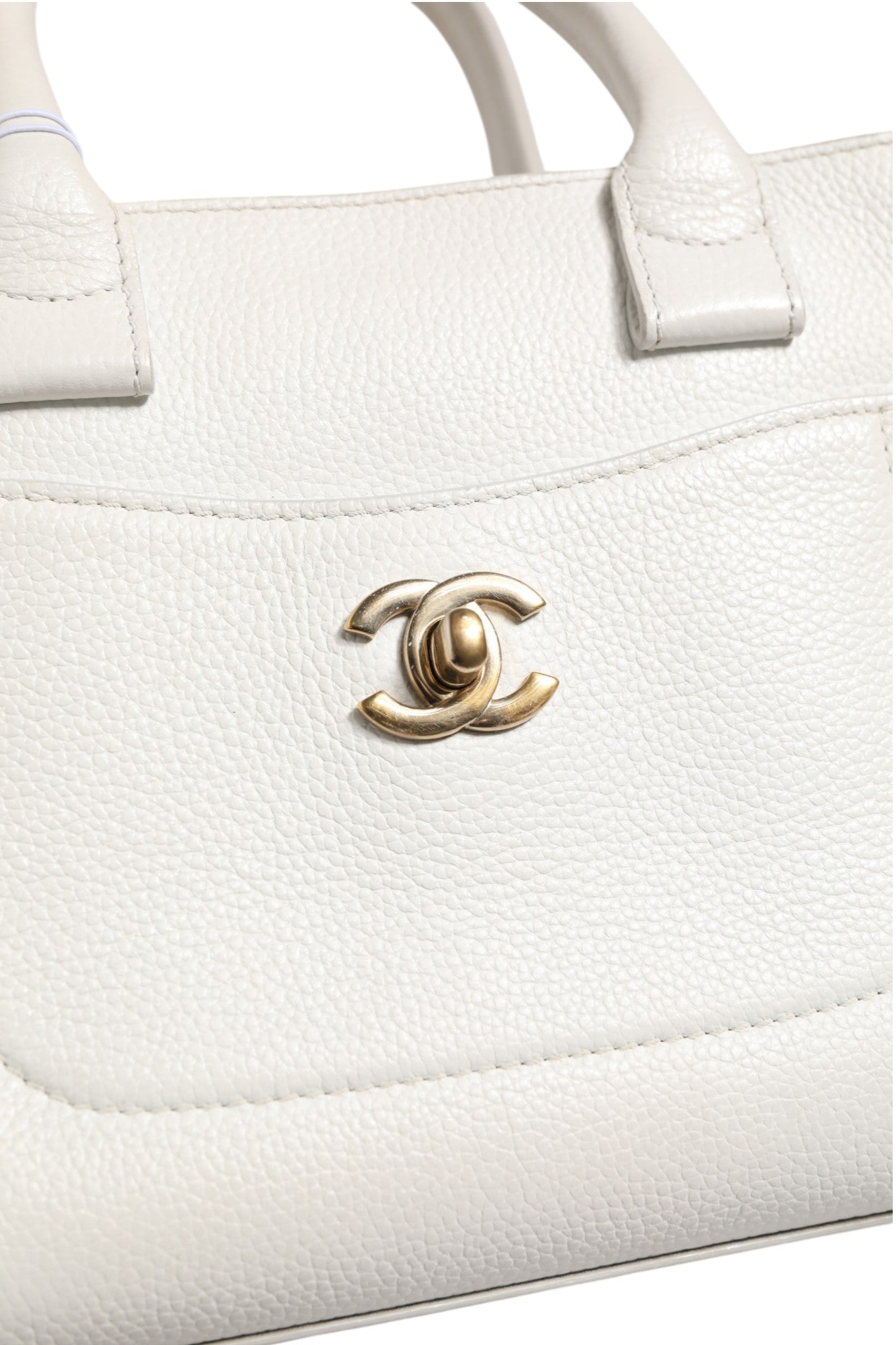 Elevate your style with the Chanel Neo Executive Tote, a masterpiece of haute couture craftsmanship, blending timeless elegance with modern sophistication for the discerning individual.