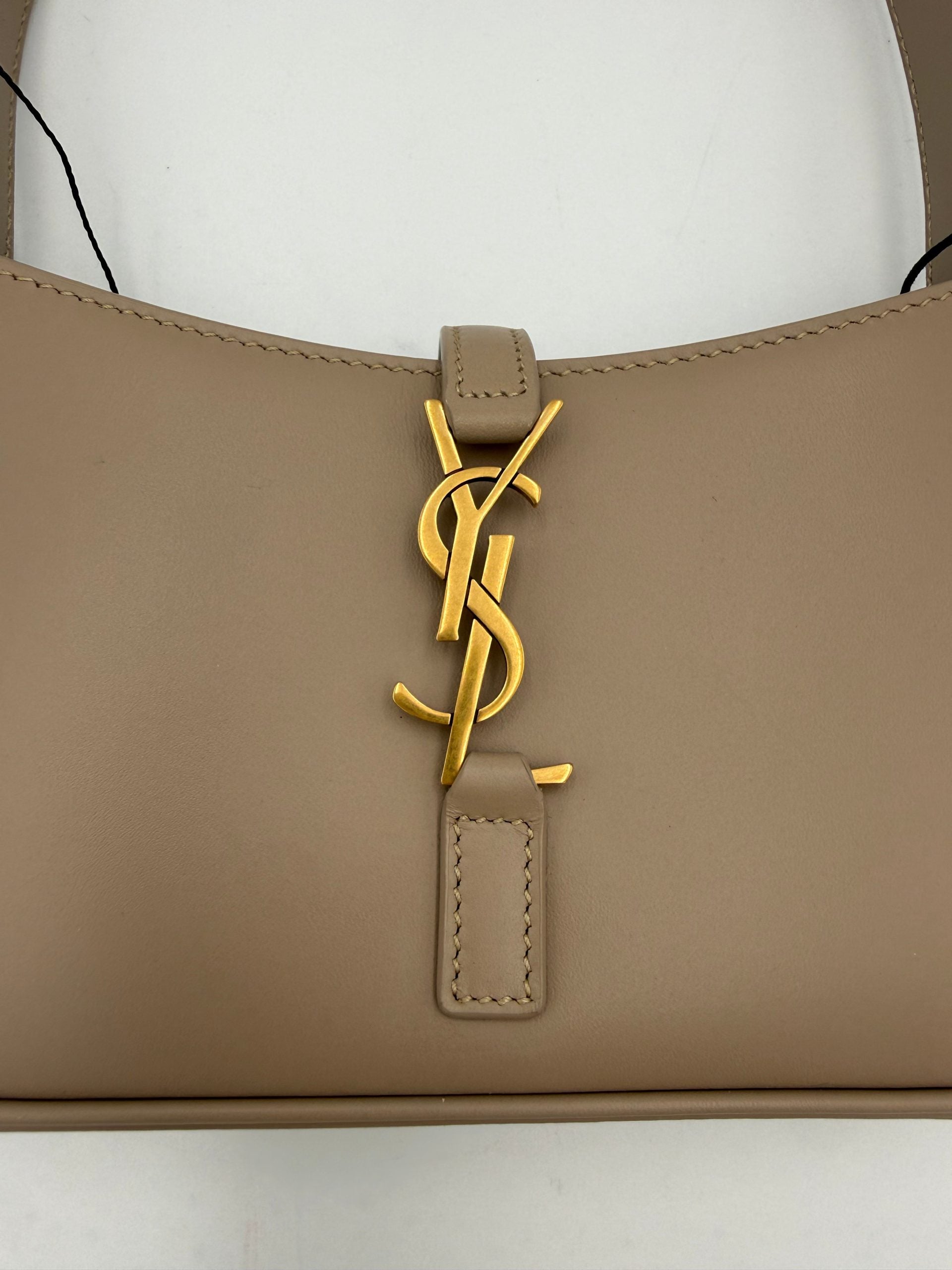 Discover the Saint Laurent LA 5 A 7 Mini Handbag, a masterpiece of artisanal elegance in luxurious leather, designed for those who embody sophistication and style.