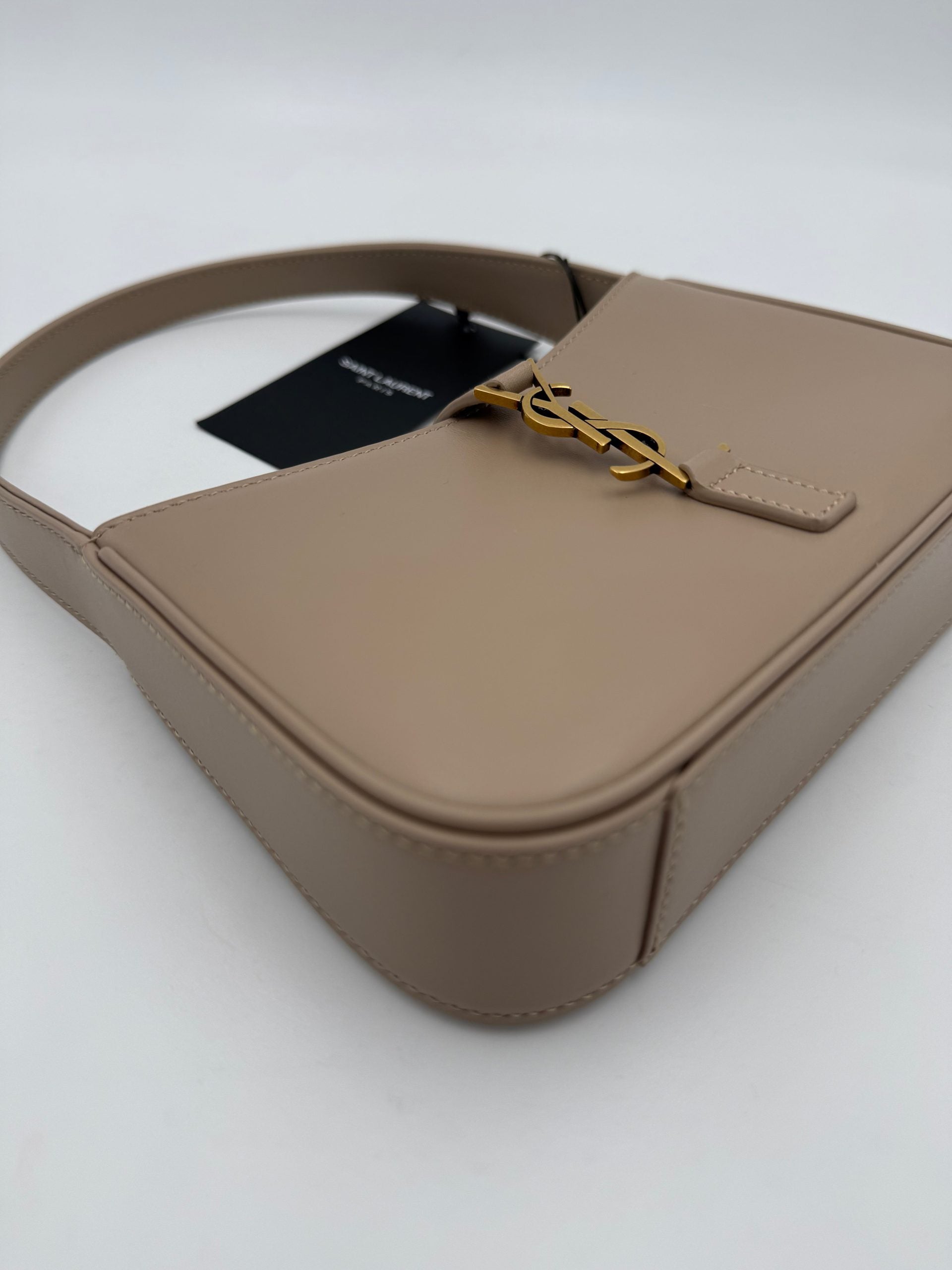 Elevate your style with the Saint Laurent LA 5 A 7 Mini Handbag, a masterpiece of artisanal elegance in luxurious leather, perfect for any sophisticated occasion.