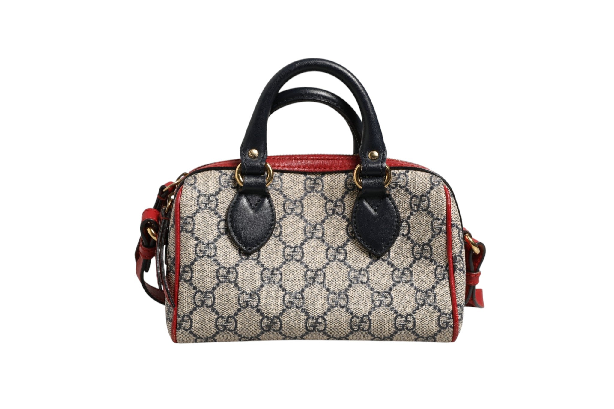 Discover the Gucci GG Supreme Mini Boston Bag, a luxurious blend of red and blue elegance, showcasing exquisite craftsmanship and timeless allure for discerning tastes.