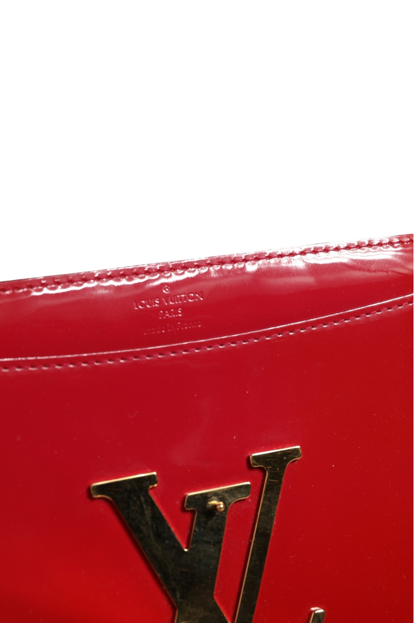Indulge in the luxurious allure of the Louis Vuitton Louise PM Red Patent Leather Wallet On Chain, a masterpiece of craftsmanship that embodies elegance and sophistication.