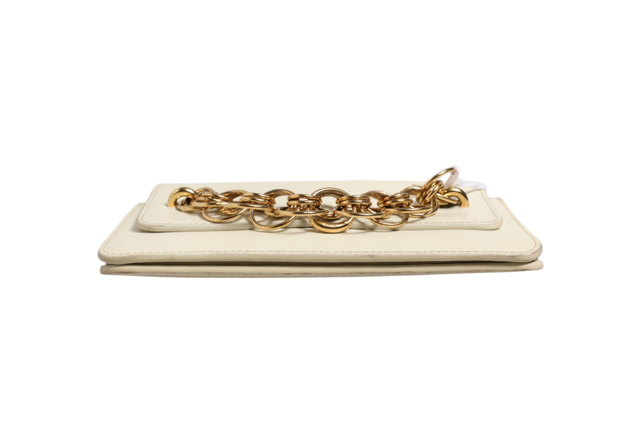 Discover the Chloé Drew Bijou Leather Clutch Small, a timeless accessory crafted with exquisite detail, embodying luxury and sophistication for the discerning individual.