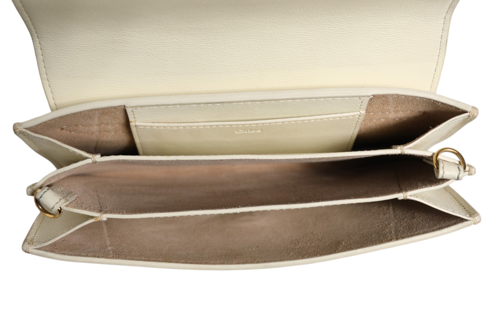 Discover the Chloé Drew Bijou Leather Clutch Small, an exquisite blend of timeless elegance and modern allure, perfect for those who appreciate luxury and sophistication.