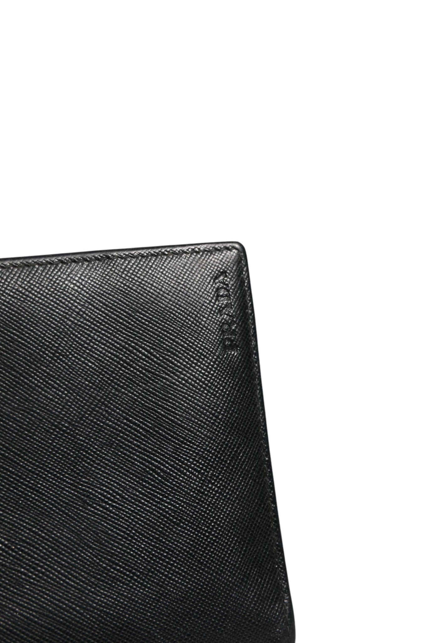 Indulge in the timeless elegance of the Prada Saffiano Leather Slim Card Holder Wallet, a luxurious accessory that embodies sophistication and exquisite craftsmanship.
