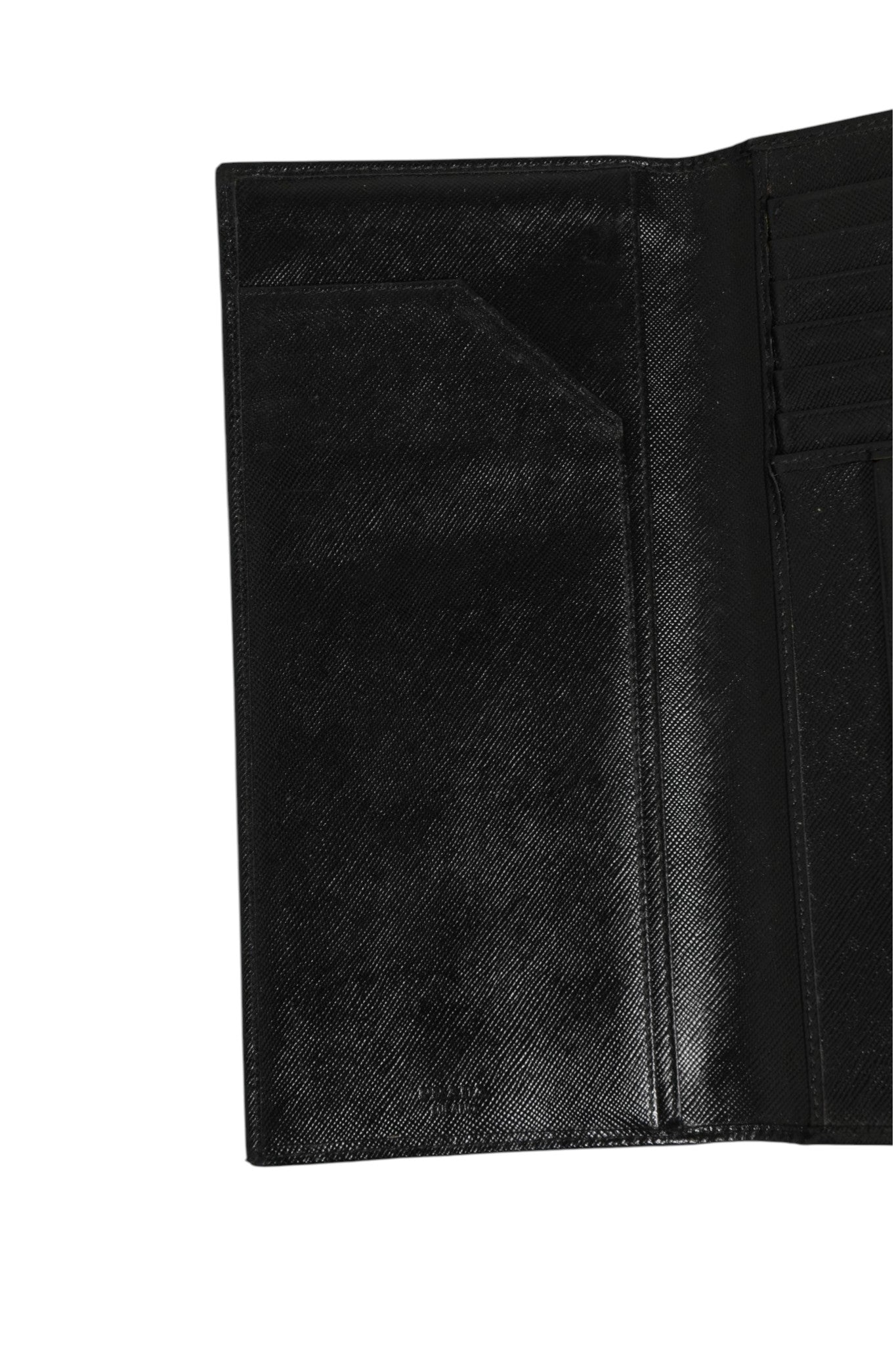 Indulge in the timeless elegance of the Prada Saffiano Leather Slim Card Holder Wallet, a luxurious accessory that embodies sophistication and exquisite craftsmanship for discerning individuals.
