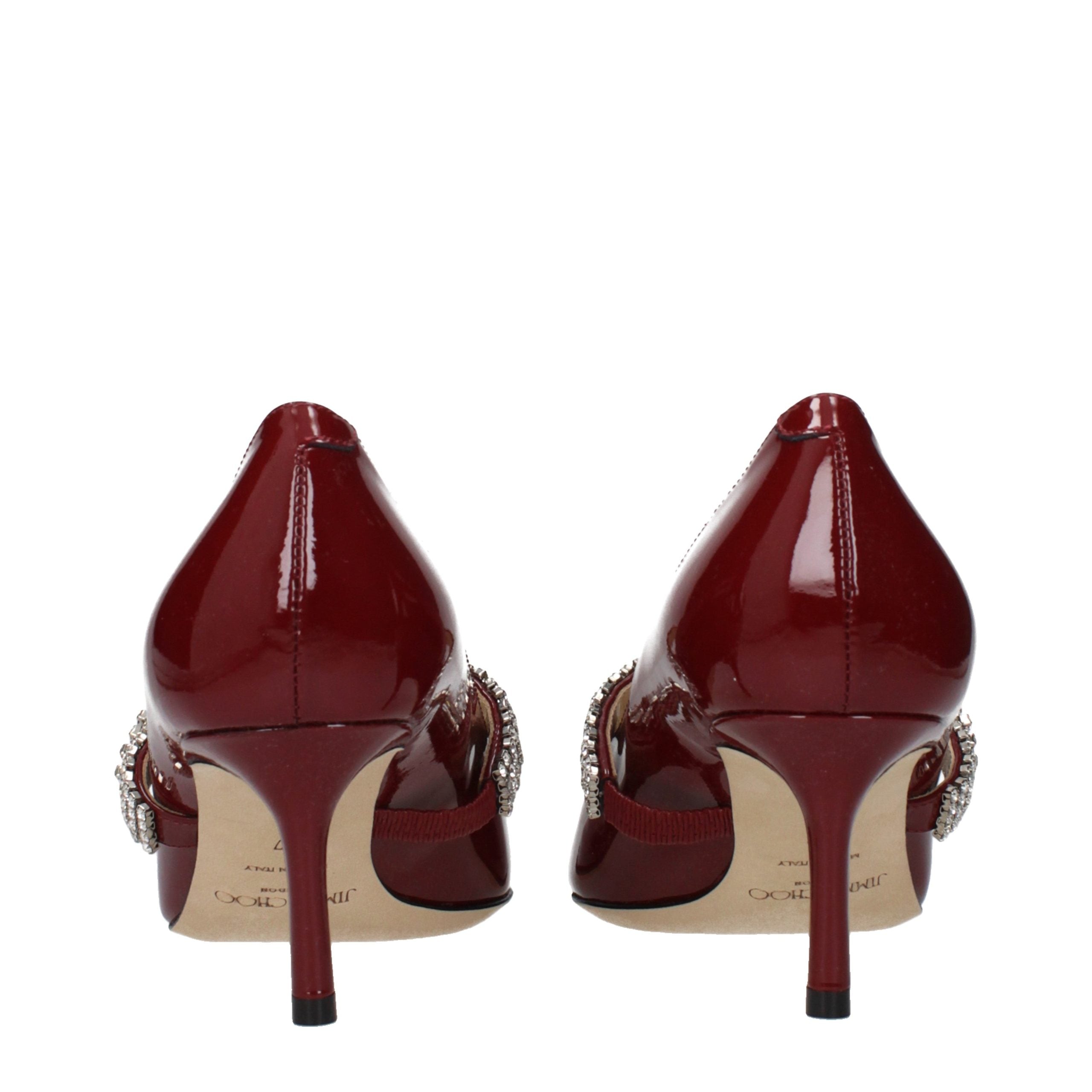 Indulge in the allure of Jimmy Choo Red Leather High Heel Pumps, where exquisite patent leather meets masterful craftsmanship, elevating your elegance for any occasion.