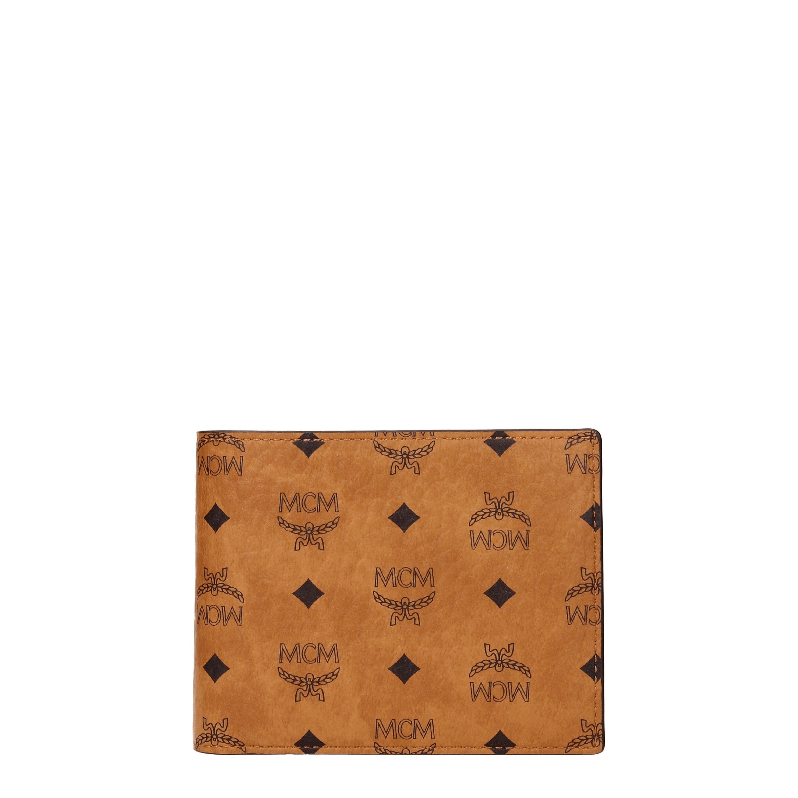 Experience the exquisite MCM Brown Fabric Wallet, a luxurious leather masterpiece that embodies sophistication and timeless elegance, perfect for discerning tastes.