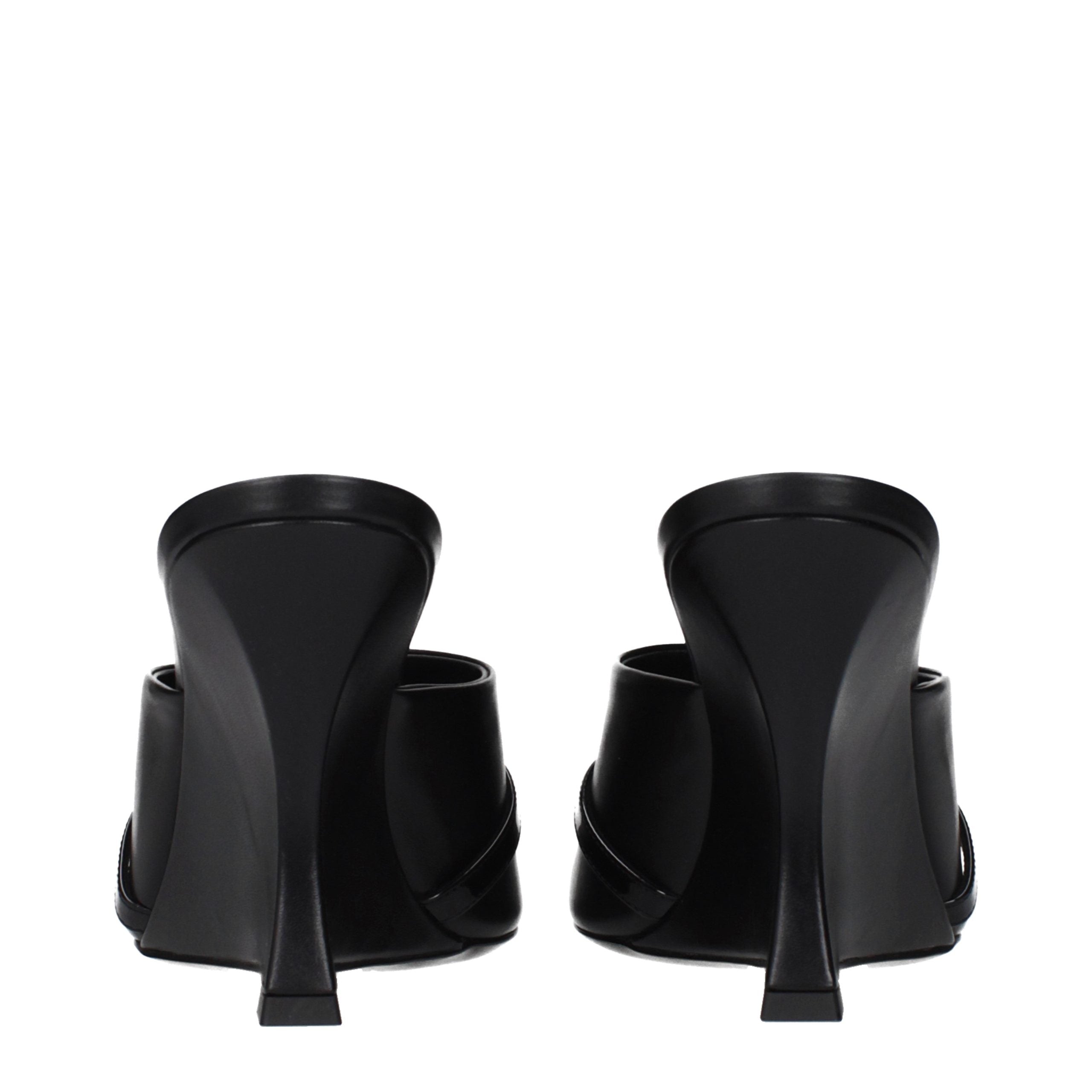 Step into a realm of elegance with Versace Black Leather Wedge Sandals, where exquisite craftsmanship meets luxurious comfort, perfect for the discerning individual.