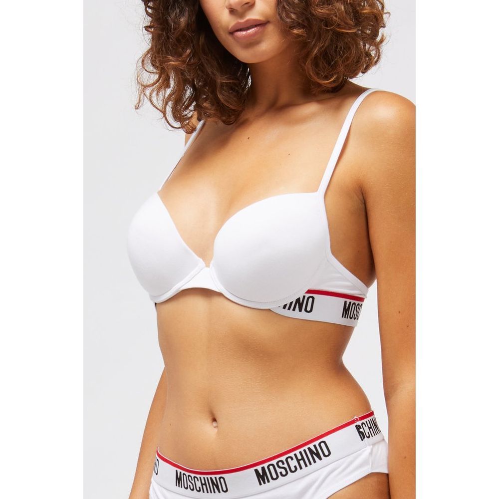 Indulge in the Moschino White Cotton Bra, where luxurious cotton meets exquisite design, embodying elegance and sophistication for the discerning individual.