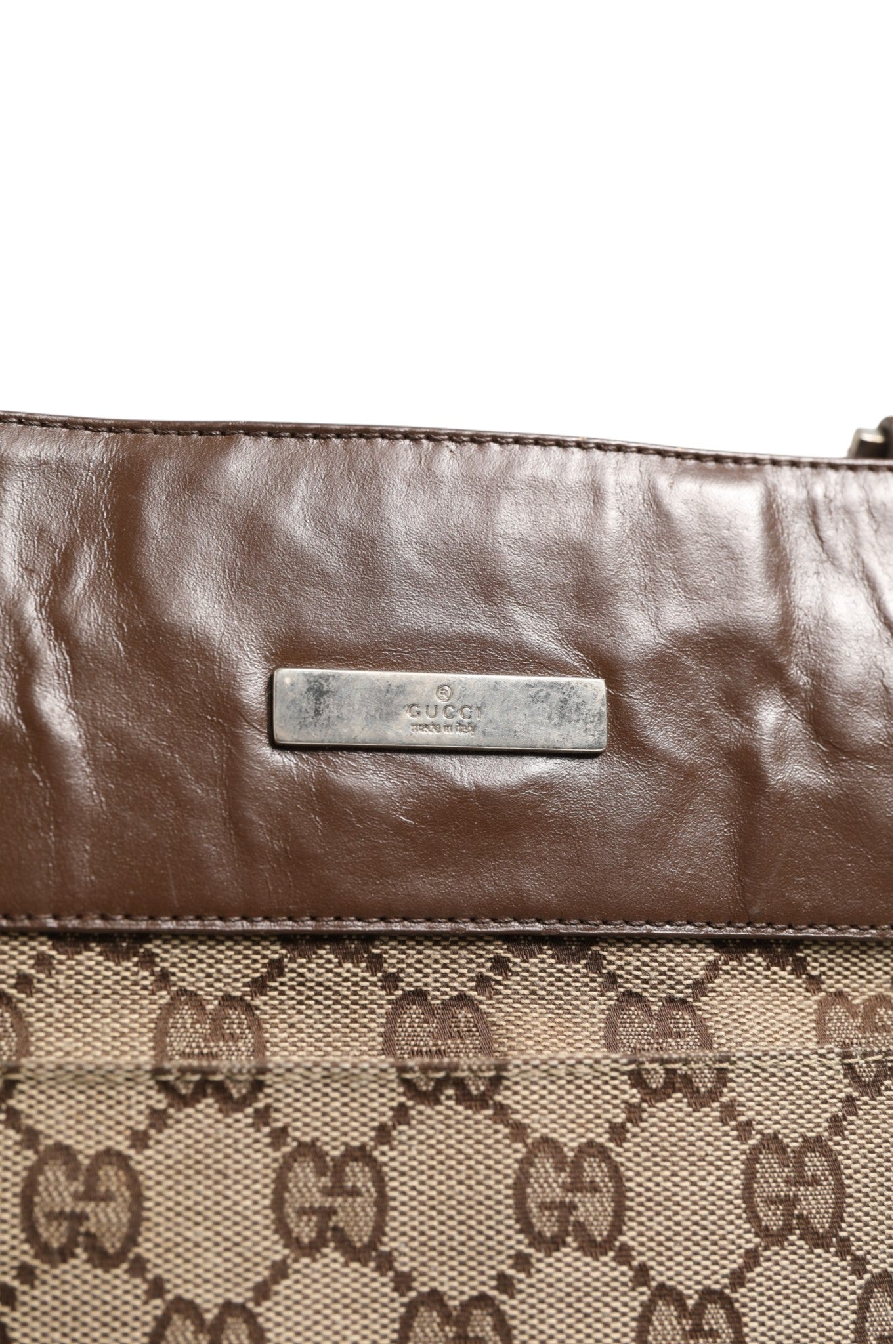 Discover the Gucci Supreme Shoulder Bag, a masterpiece of Italian craftsmanship in rich brown leather, embodying timeless luxury and sophistication for the discerning individual.