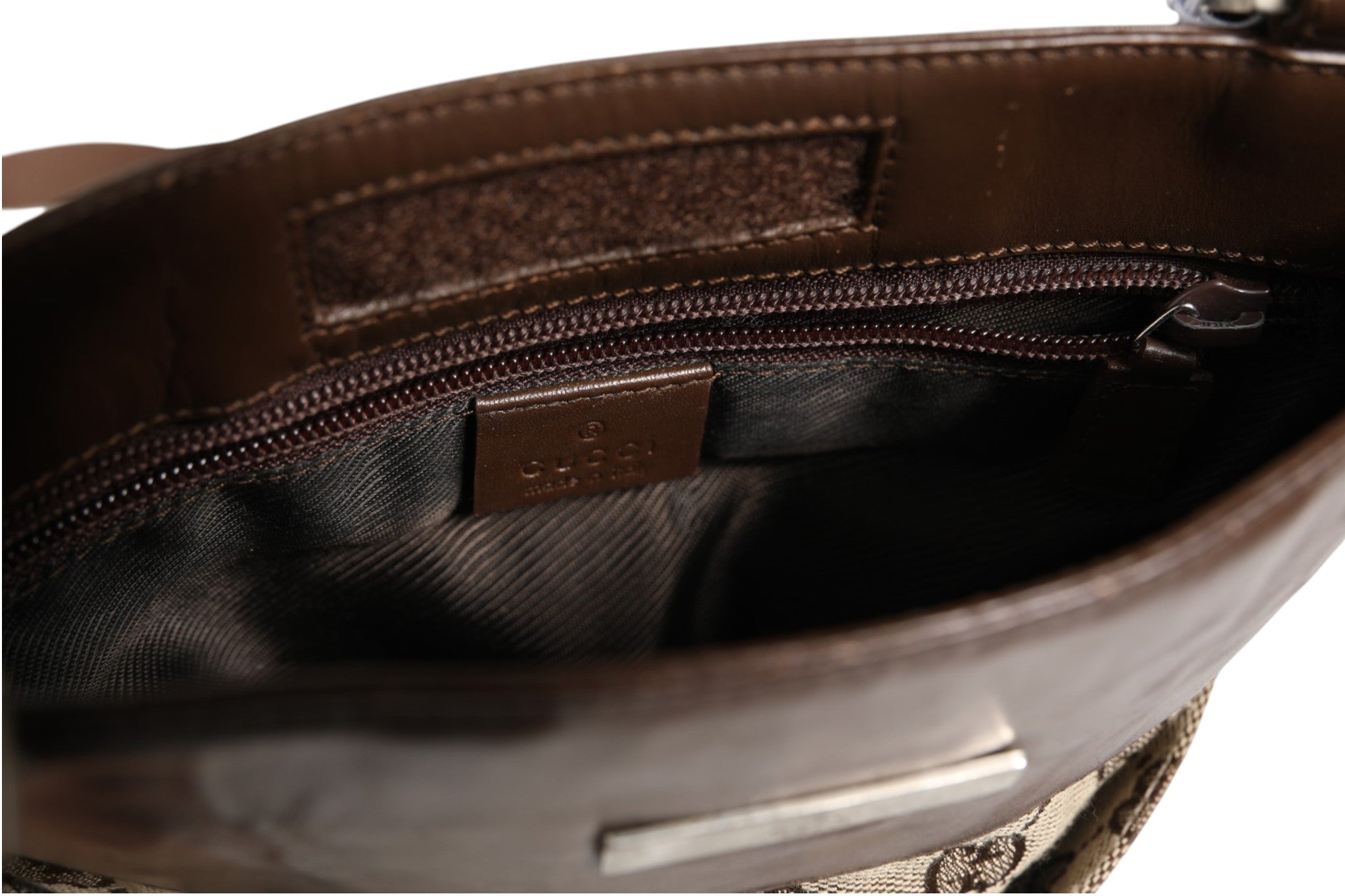 Discover the Gucci Supreme Shoulder Bag, a symbol of timeless luxury and exquisite craftsmanship, perfect for those who embrace elegance and sophistication in every moment.