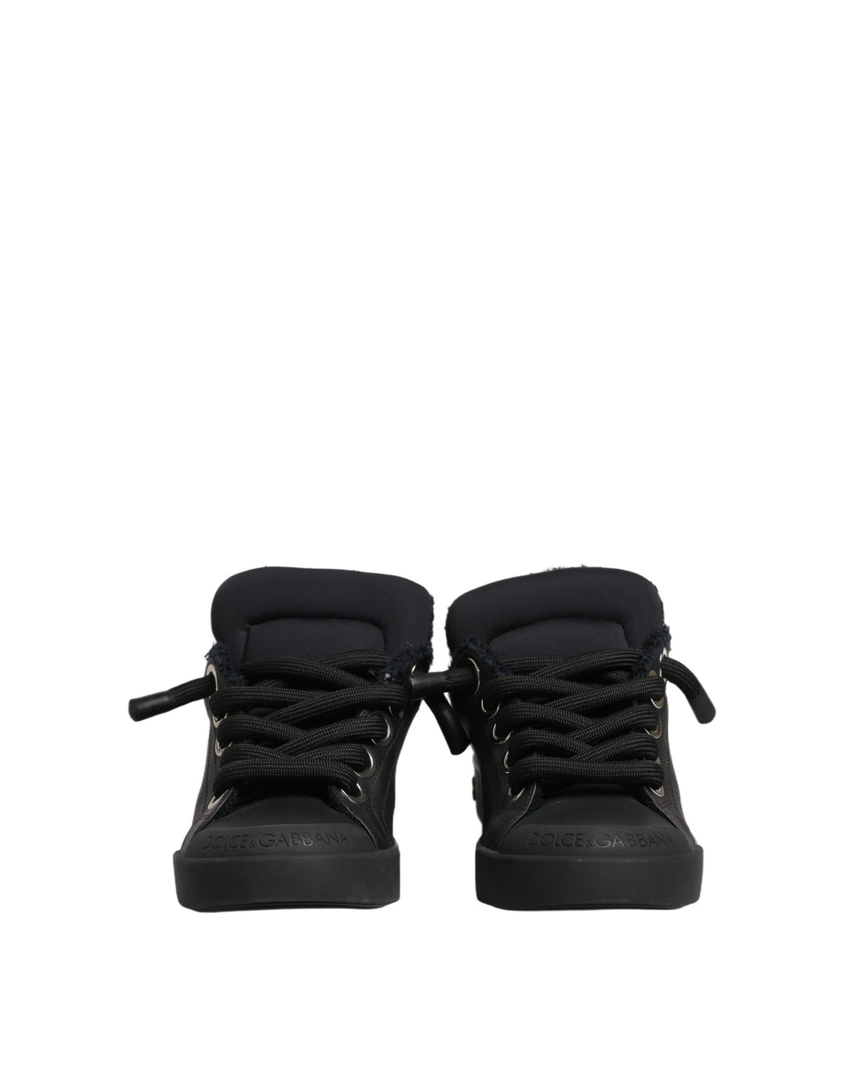 Discover the exquisite Dolce & Gabbana Black Leather Low Top Portofino Sneakers, where artisanal craftsmanship meets luxurious comfort for the discerning individual.