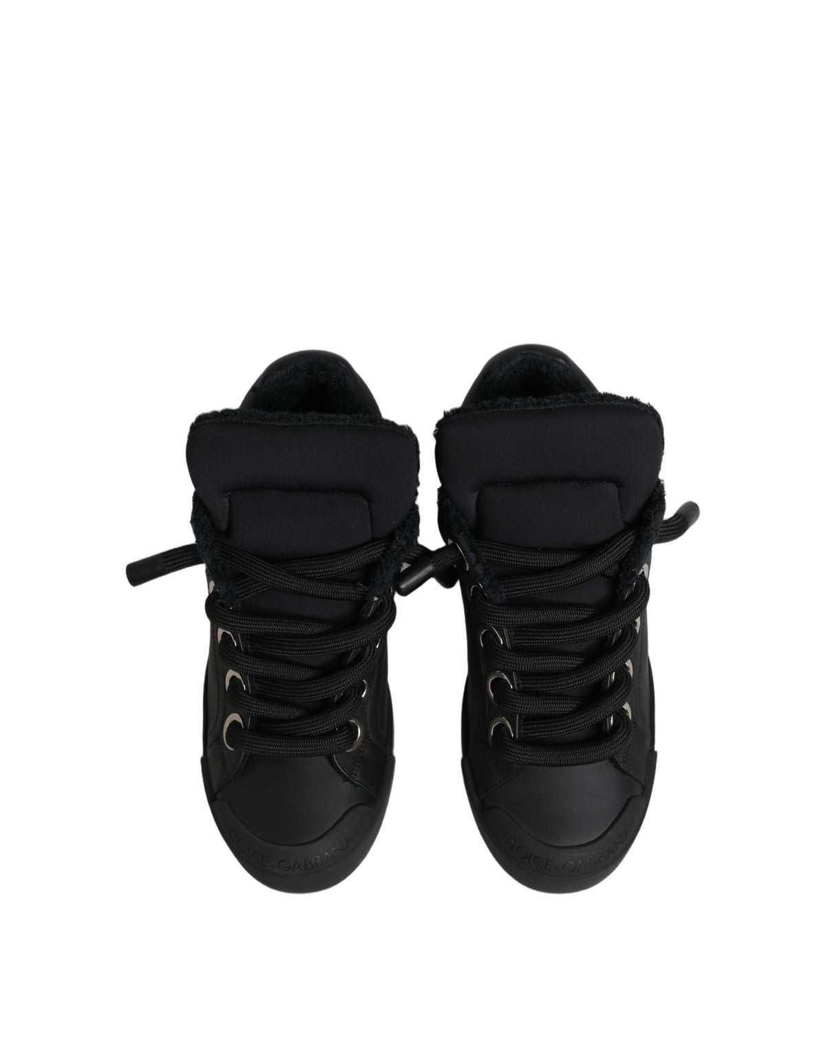 Step into the world of Dolce & Gabbana with the Black Leather Low Top Portofino Sneakers, where exquisite craftsmanship meets timeless elegance, perfect for the discerning individual.