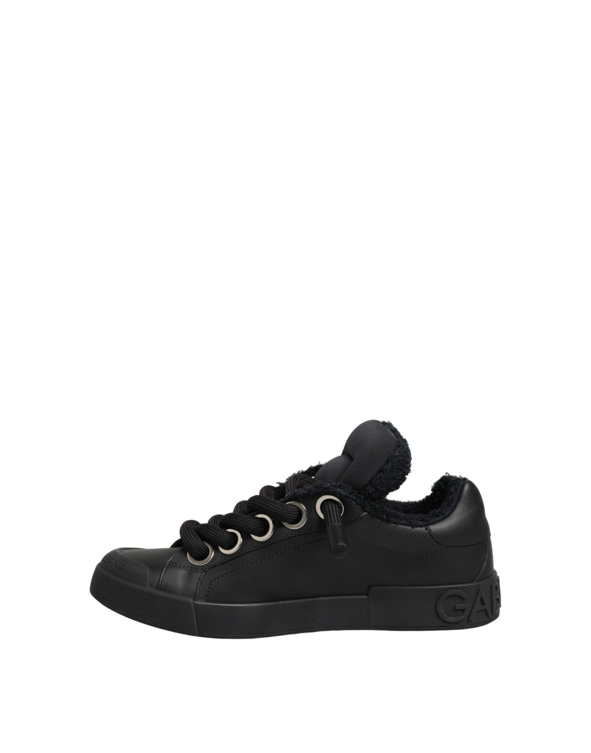 Experience the artistry of Dolce & Gabbana's Black Leather Low Top Portofino Sneakers, where exquisite craftsmanship meets timeless elegance, perfect for the discerning individual.