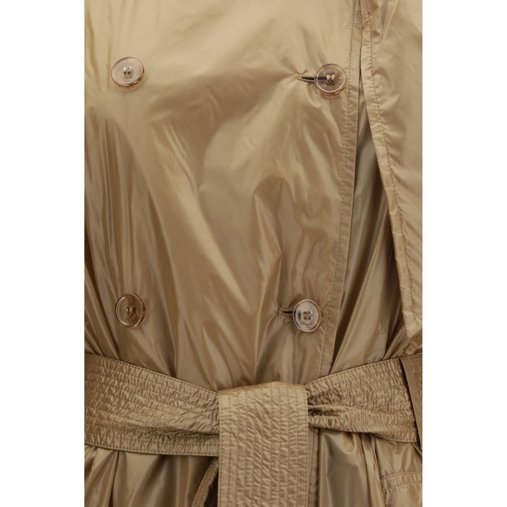 Discover the Saint Laurent Beige Polyamide Trench Coat, a masterpiece of modern elegance and timeless design, crafted for those who embrace sophistication and allure.