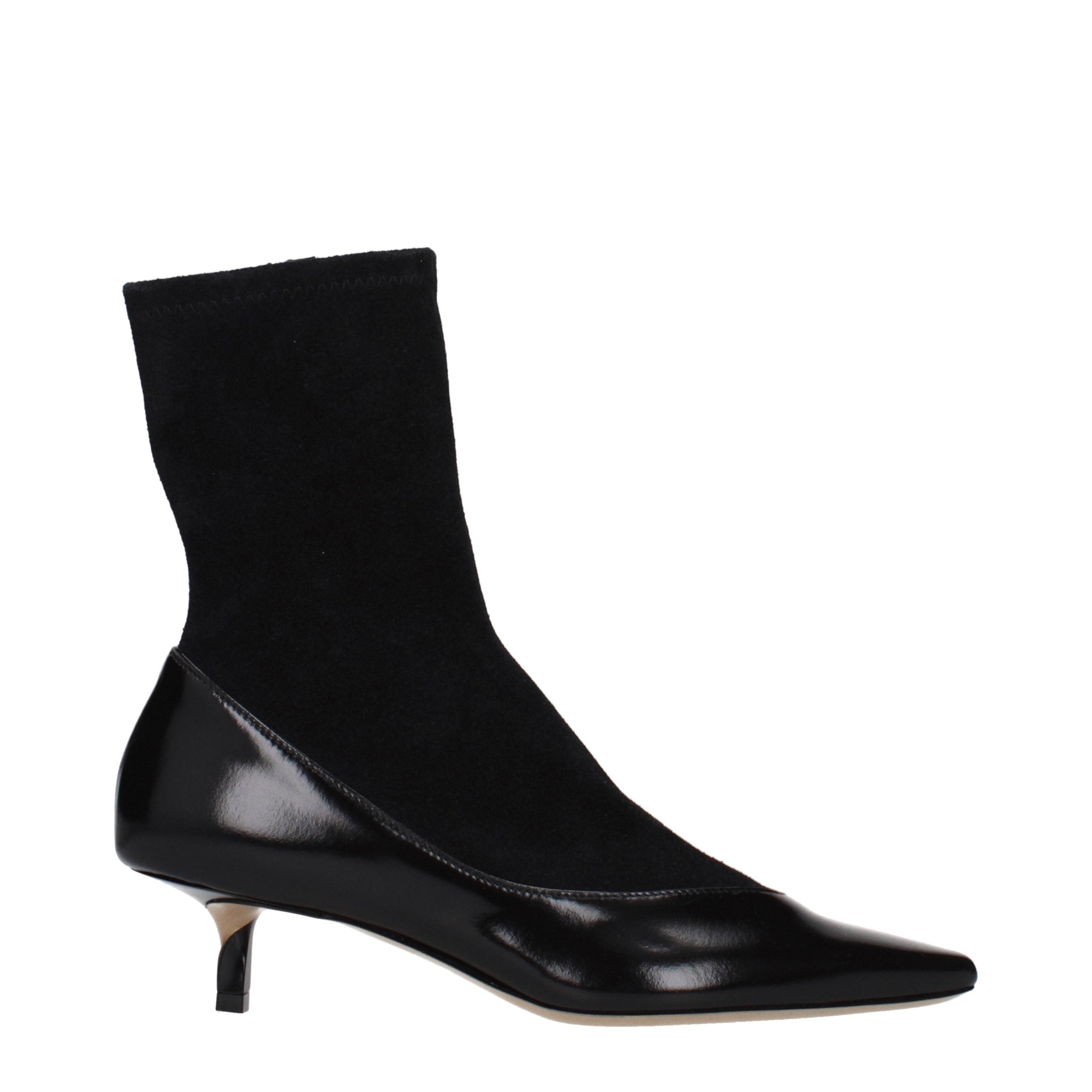 Step into timeless elegance with Jacquemus Black Leather Ankle Boots, crafted from premium suede, embodying sophistication and artisanal luxury for the discerning connoisseur.