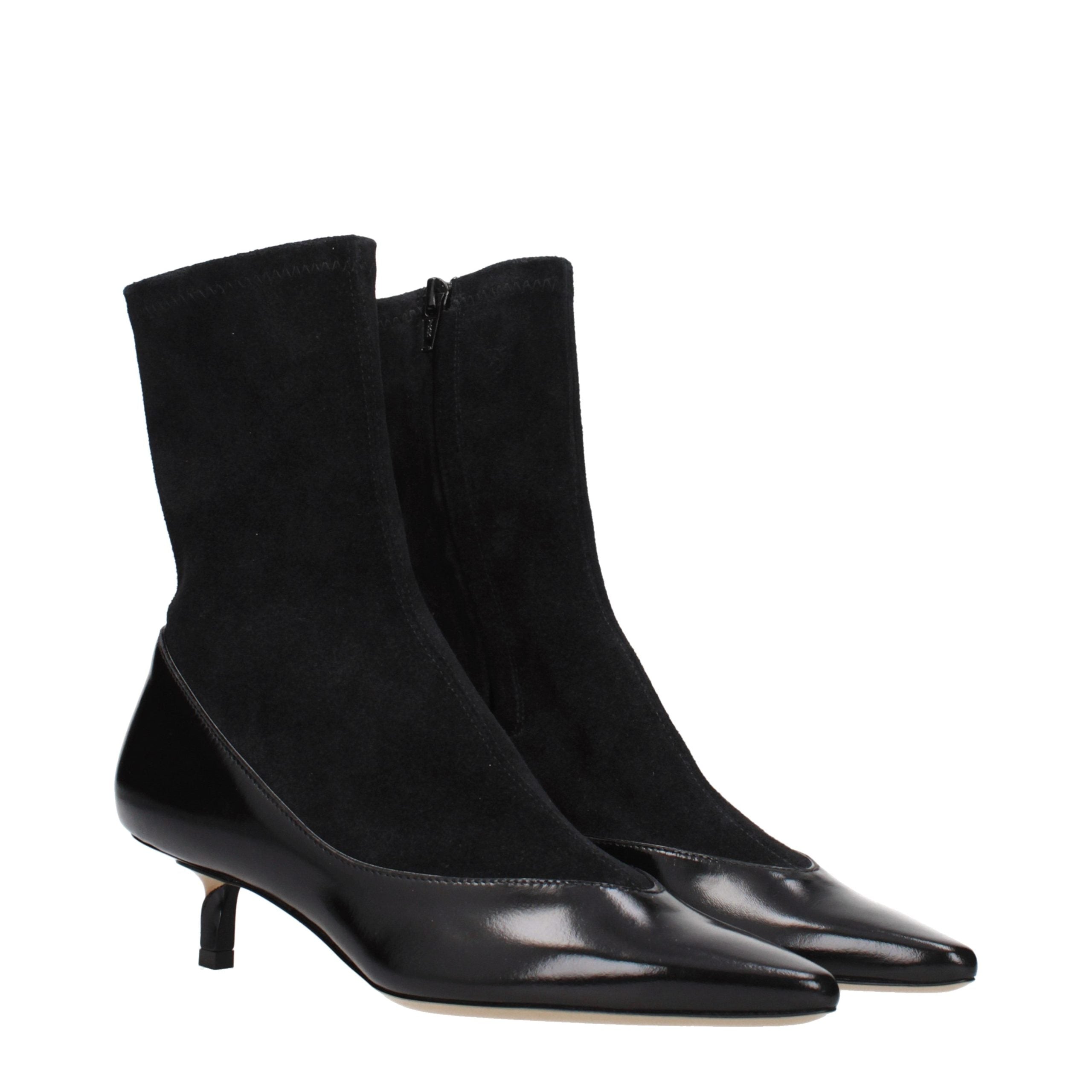 Indulge in the timeless elegance of Jacquemus Black Leather Ankle Boots, crafted from premium suede, embodying sophistication and artisanal quality for the discerning connoisseur.