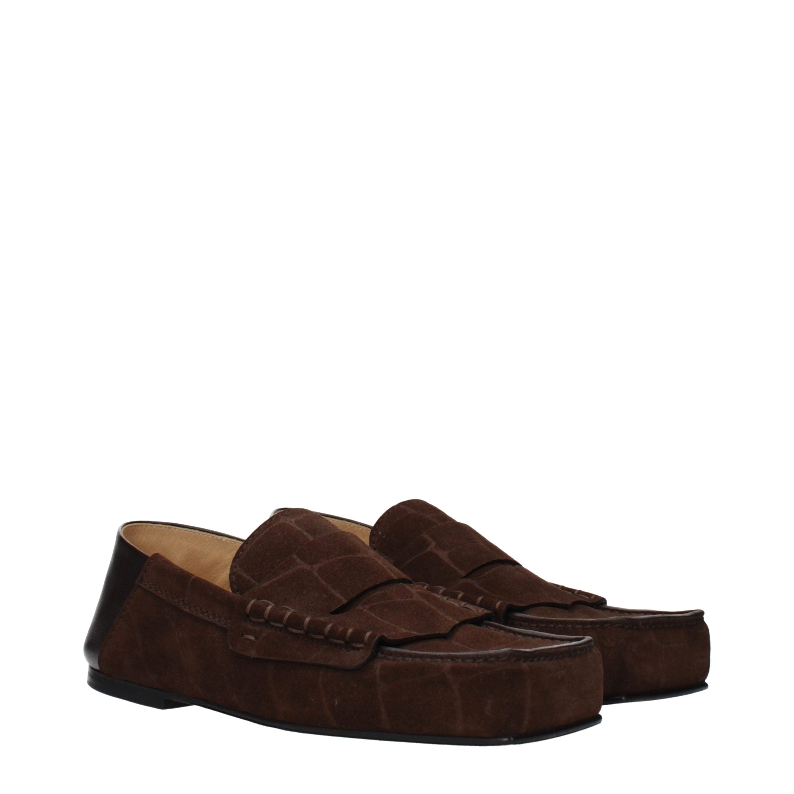 Indulge in the Jacquemus Brown Leather Slip-On Loafers, where artisanal craftsmanship meets vintage elegance, elevating your style with every luxurious step.
