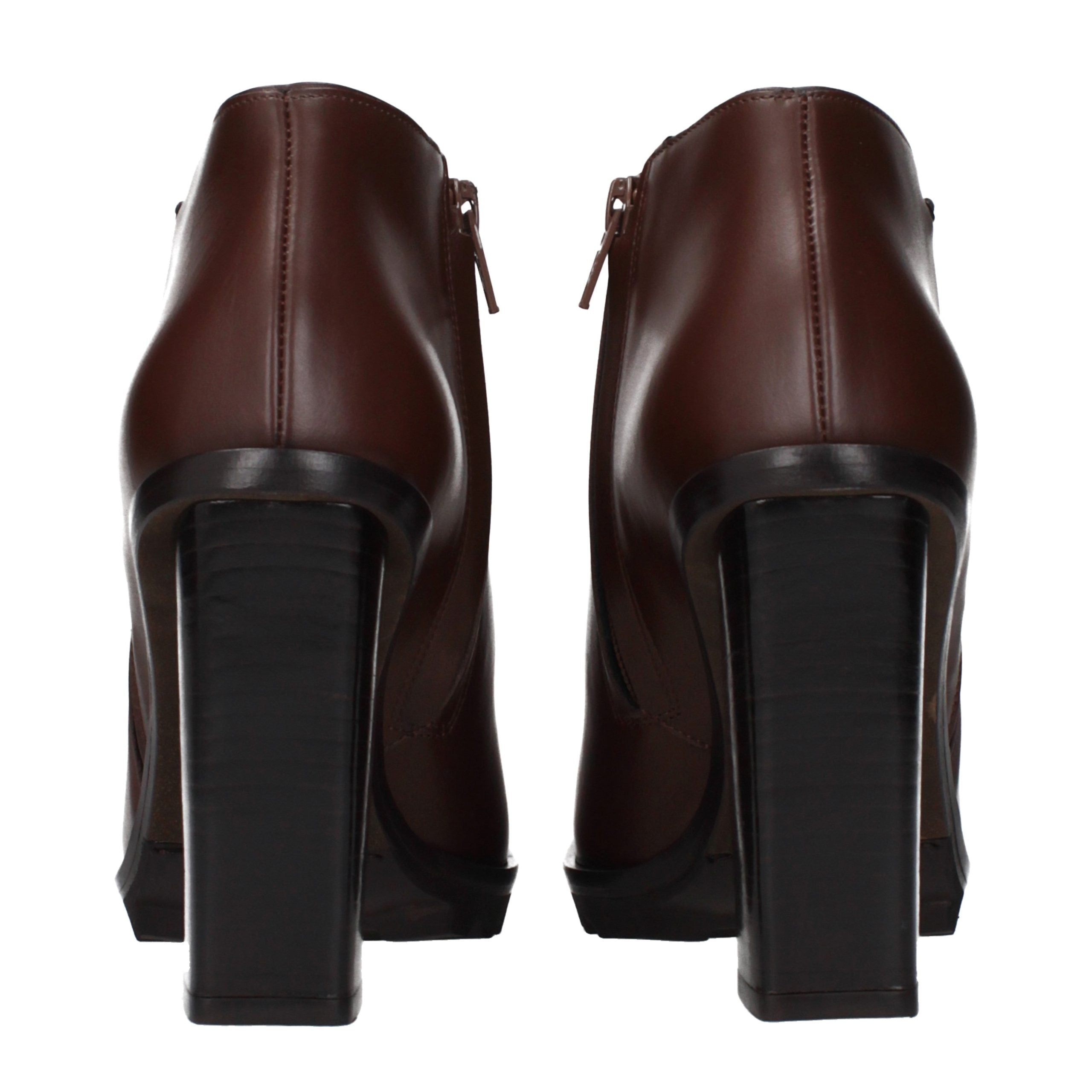 Experience the exquisite allure of Max Mara's Brown Leather Ankle Boots, a timeless blend of Italian craftsmanship and luxurious elegance, perfect for any refined wardrobe.