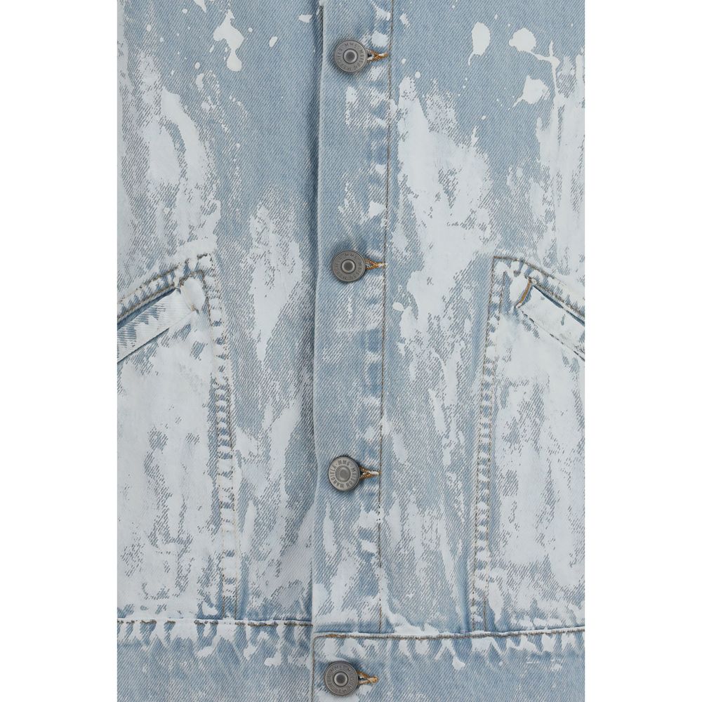 Elevate your style with the MM6 Denim Jacket, a 100% cotton masterpiece that fuses timeless elegance and avant-garde artistry for the discerning individual.