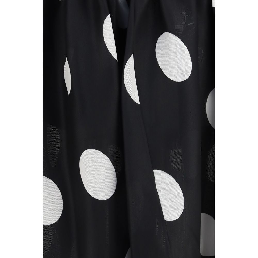 Indulge in the Khaite Black Silk Skirt, a Spring/Summer 2026 masterpiece of silk gazar, showcasing artisanal craftsmanship and playful elegance for the discerning individual.