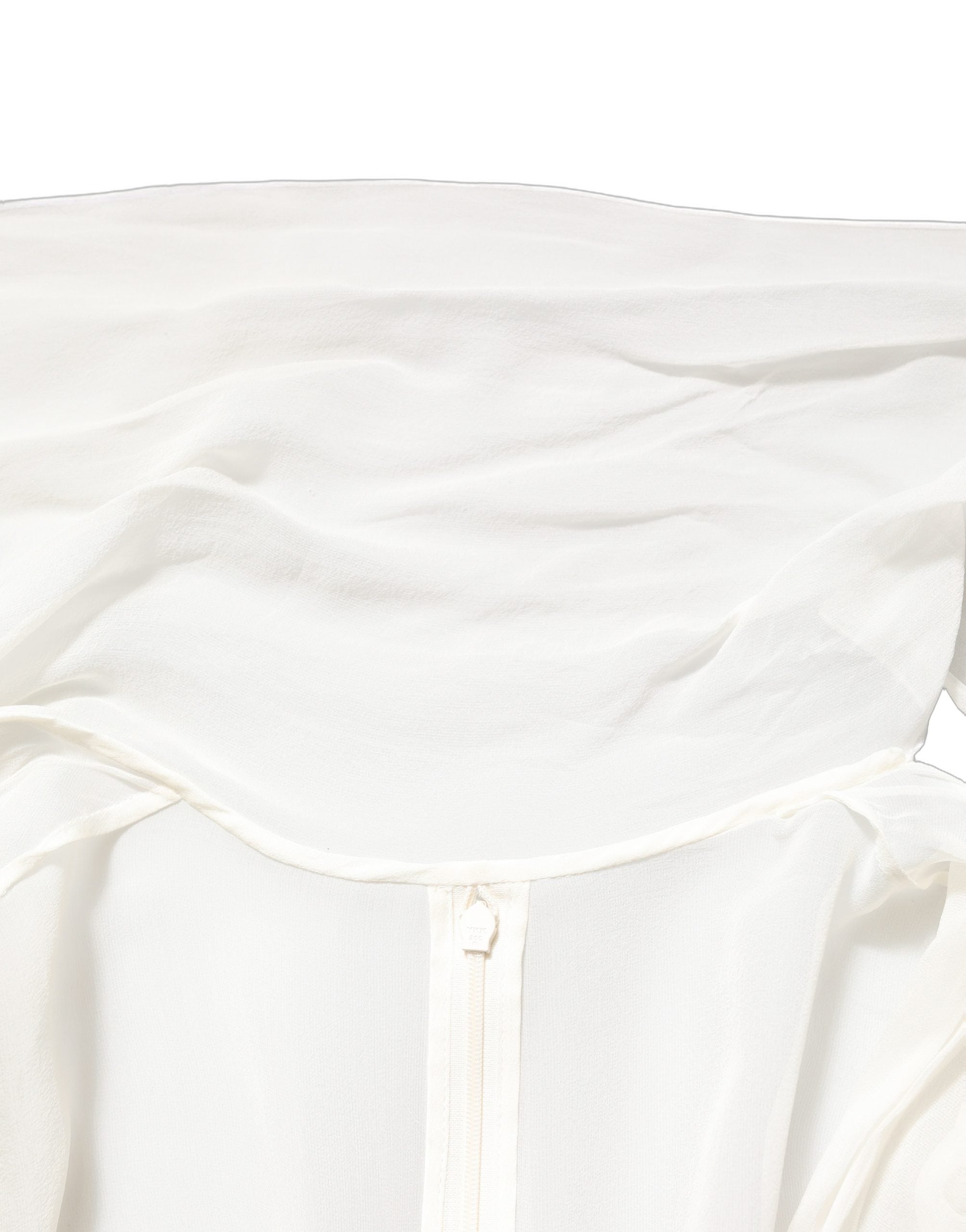 Experience the allure of the Dolce & Gabbana White Silk Sheer Draped Long Gown, a timeless masterpiece of Italian craftsmanship that embodies luxury and elegance.