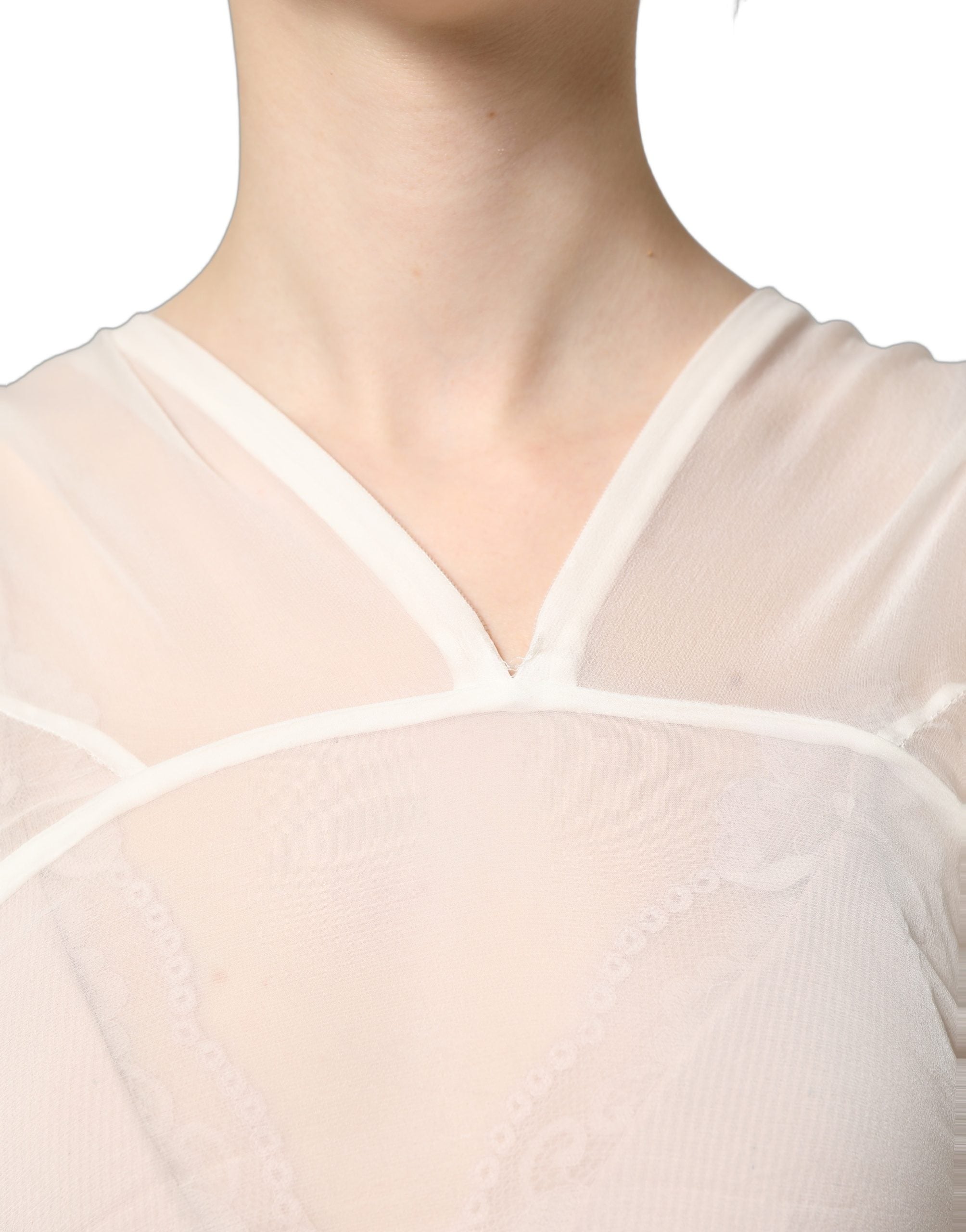 Experience the allure of the Dolce & Gabbana White Silk Sheer Draped Long Gown, a timeless masterpiece that embodies Italian luxury and exquisite craftsmanship.