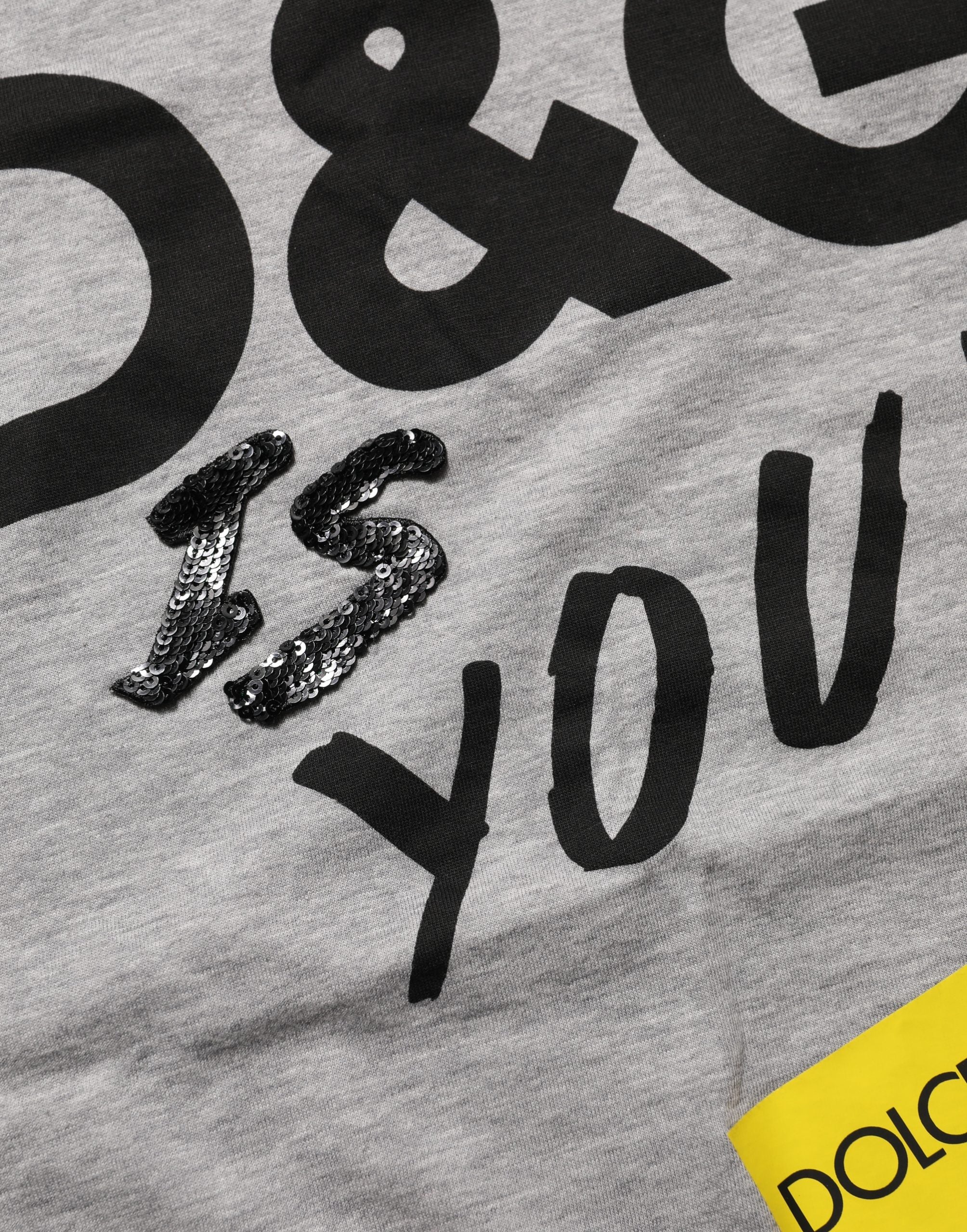 Elevate your wardrobe with the Dolce & Gabbana Gray Cotton Logo Printed Crew Neck T-shirt, a timeless blend of luxury and urban sophistication, crafted in Italy.