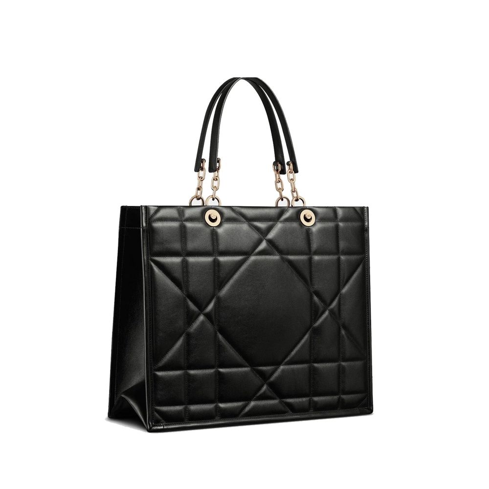 Indulge in the exquisite Dior Black Leather Tote Bag, crafted from 100% leather with a sumptuous suede lining, embodying timeless elegance and unparalleled luxury.