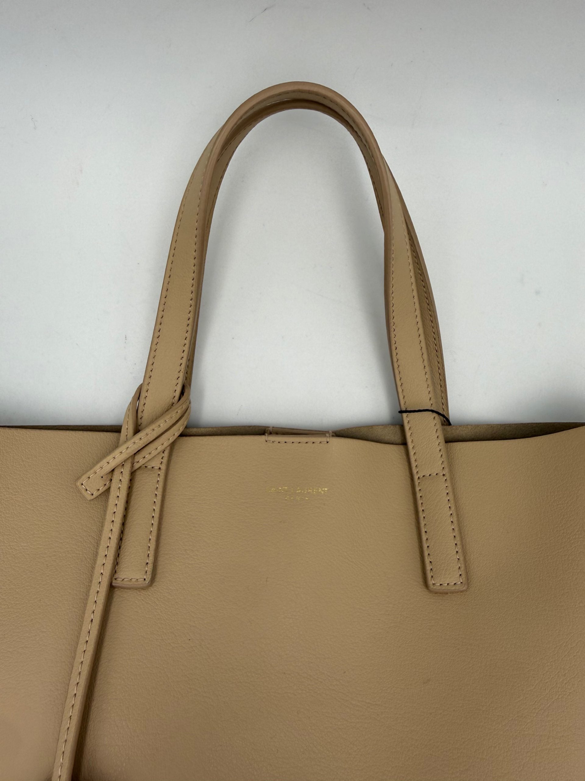 Elevate your style with the Saint Laurent SAINT LAURENT SHOPPING Beige Bag, a masterpiece in fine calf leather, exuding timeless elegance and sophisticated allure.