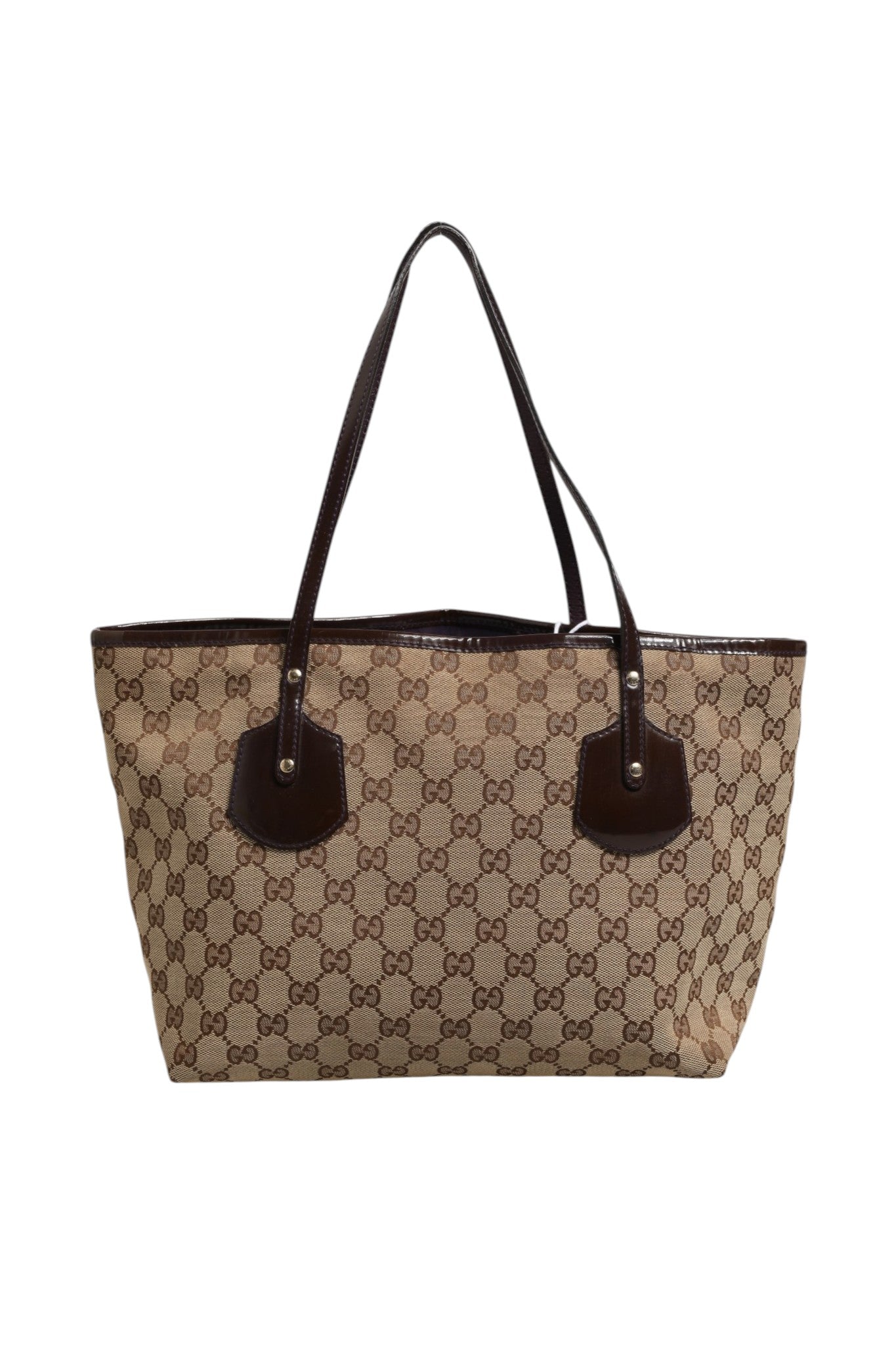 Elevate your style with the Gucci Beige Canvas Medium Jolie Charm Tote Bag, a testament to luxury craftsmanship and timeless elegance, perfect for any sophisticated occasion.