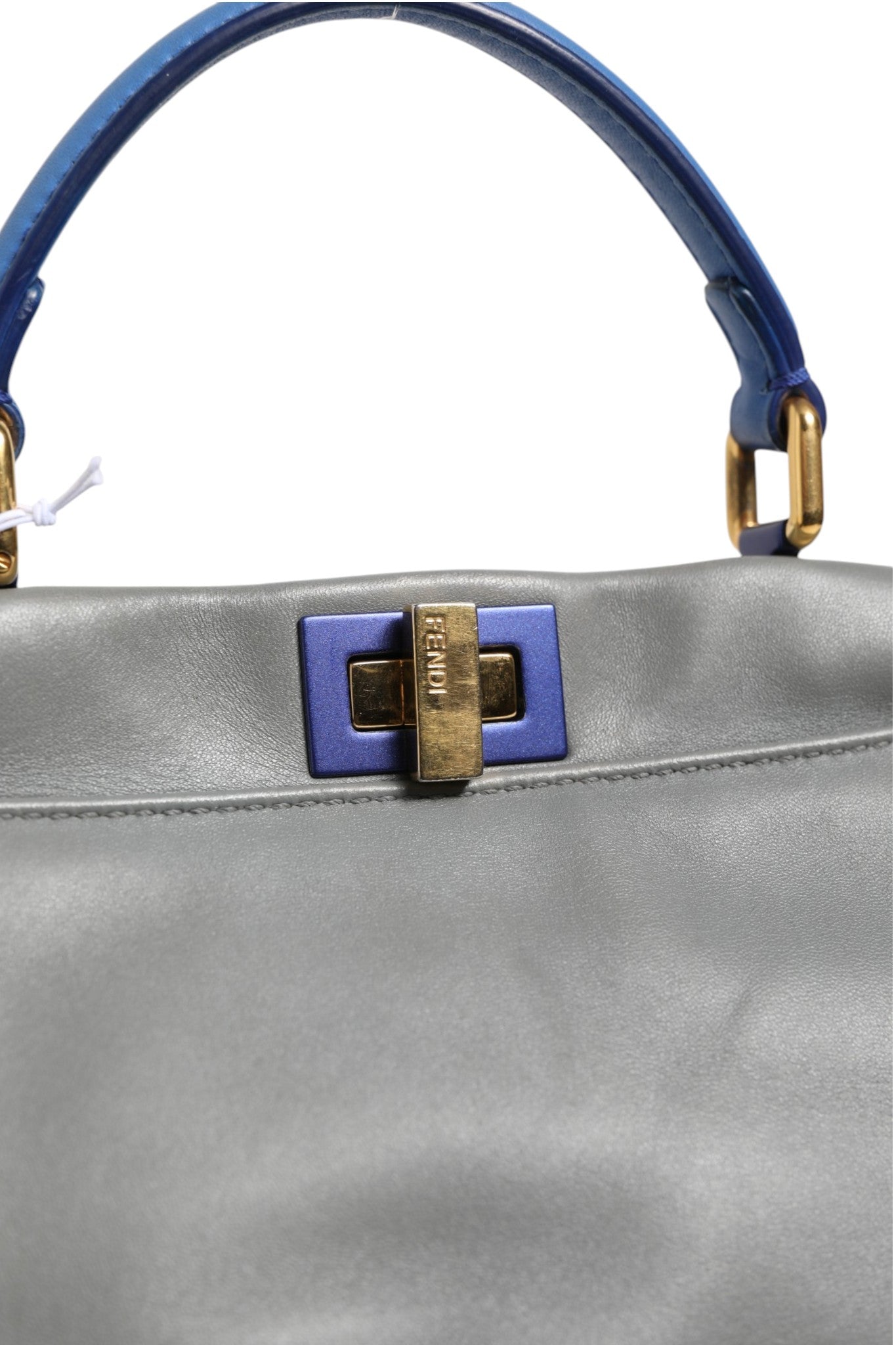 Discover the Fendi Mini Peekaboo Blue Grey, a masterpiece of Italian craftsmanship that embodies timeless elegance and sophisticated allure for the discerning individual.