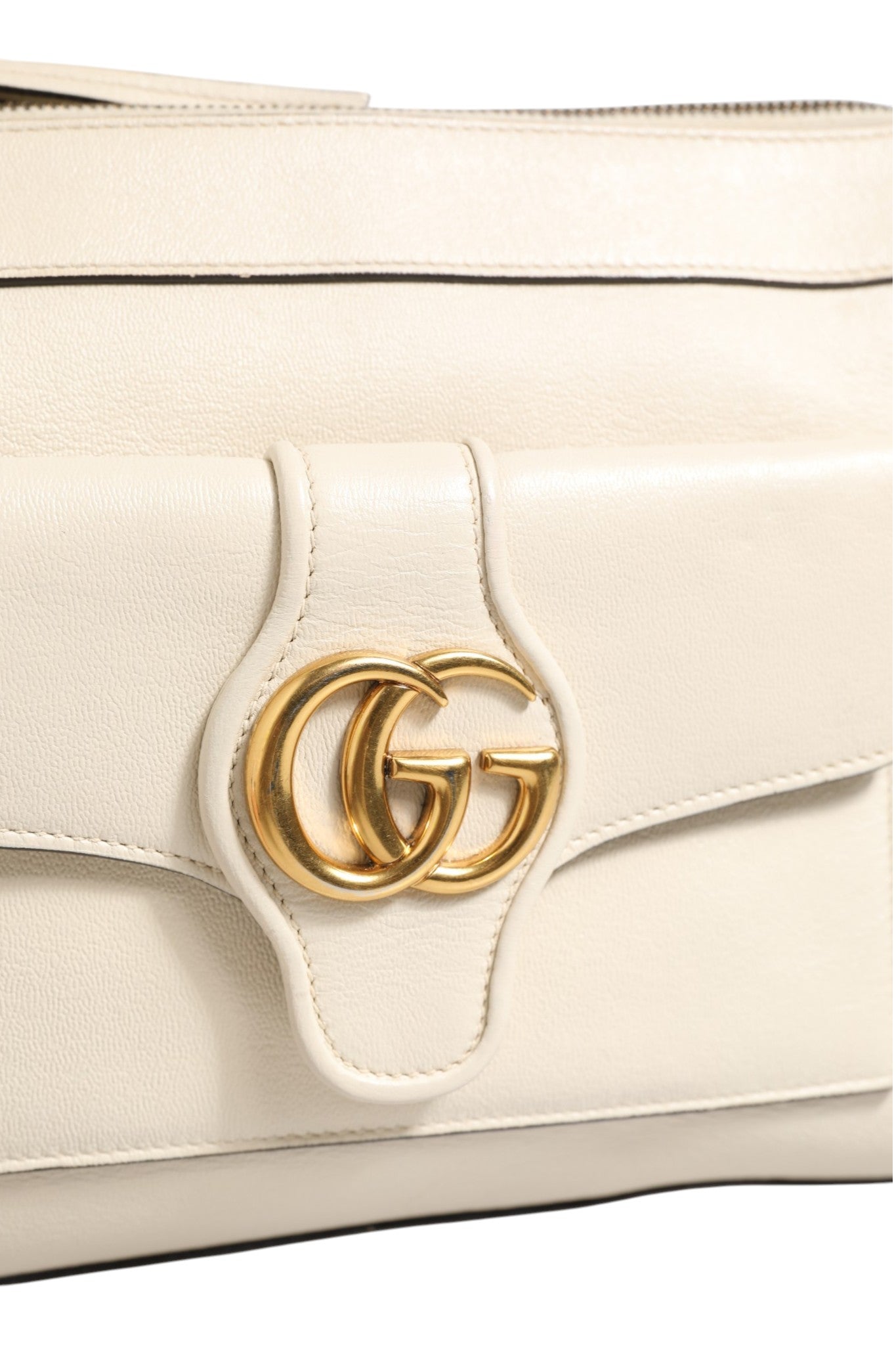Discover the Gucci Arli Small Crossbody Bag in off-white leather, a symbol of sophistication and exquisite craftsmanship that elevates any ensemble with timeless elegance.